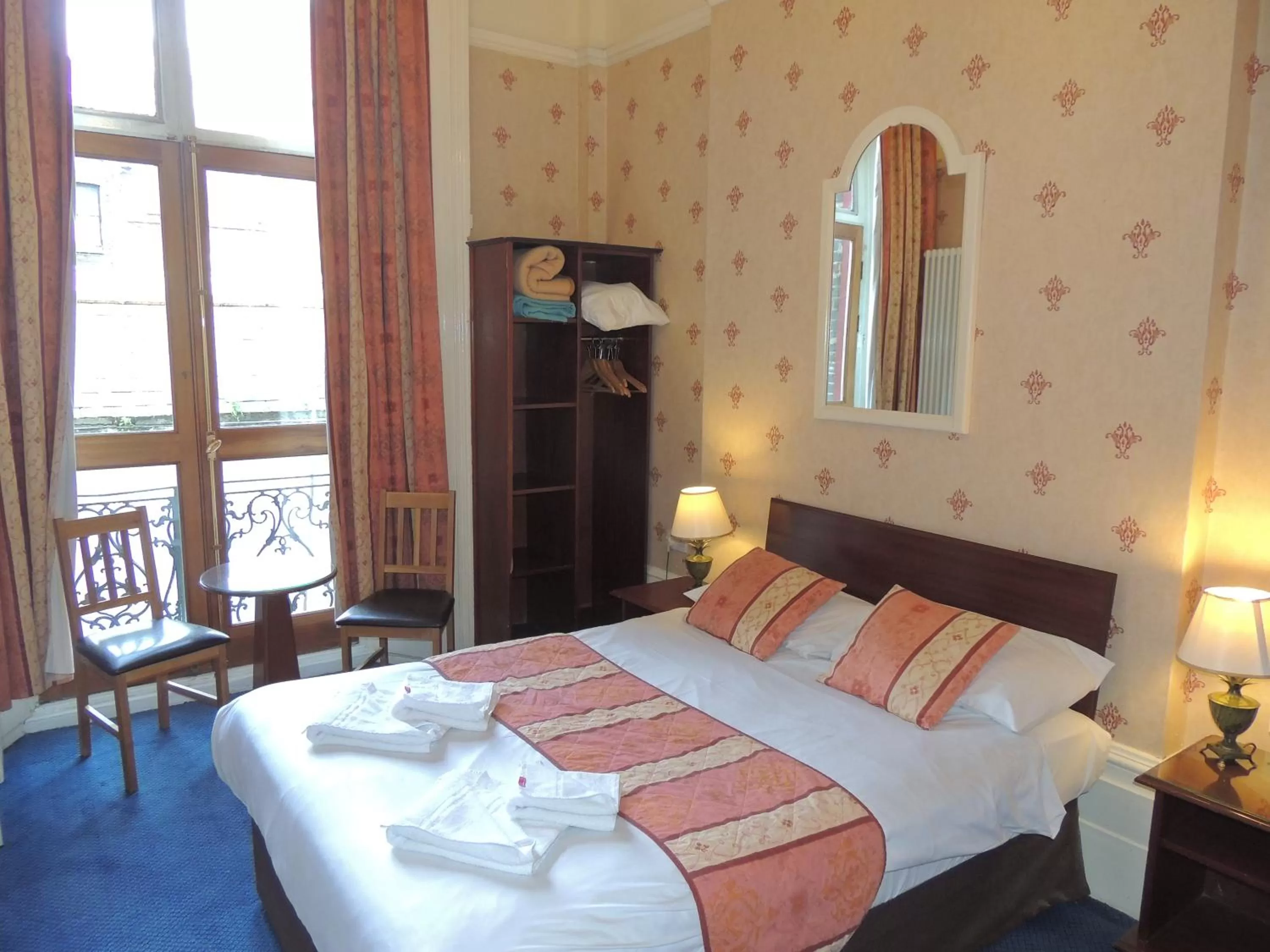 Balcony/Terrace, Bed in Dolphin Hotel