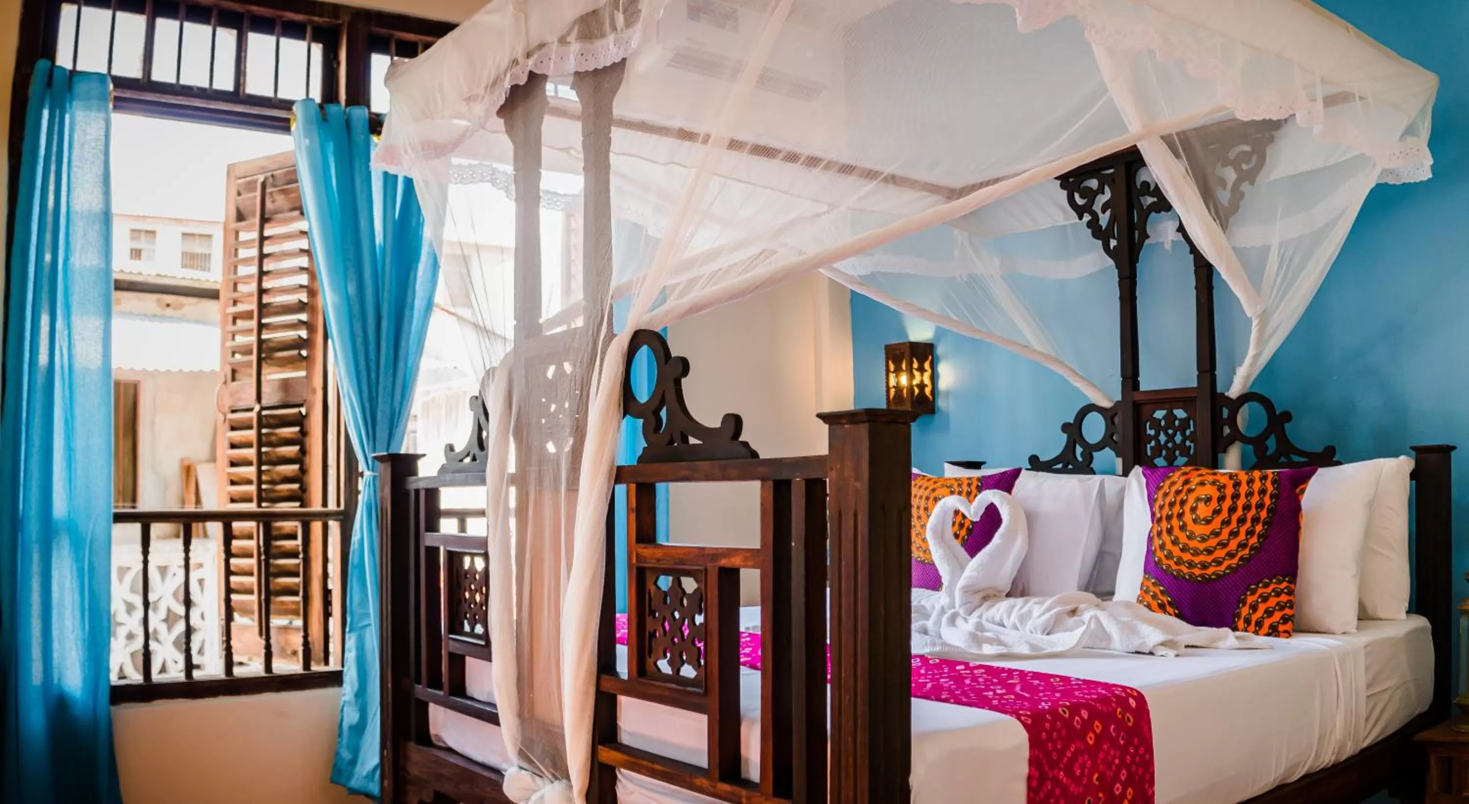 Bed in Emerald Palm Boutique Hotel