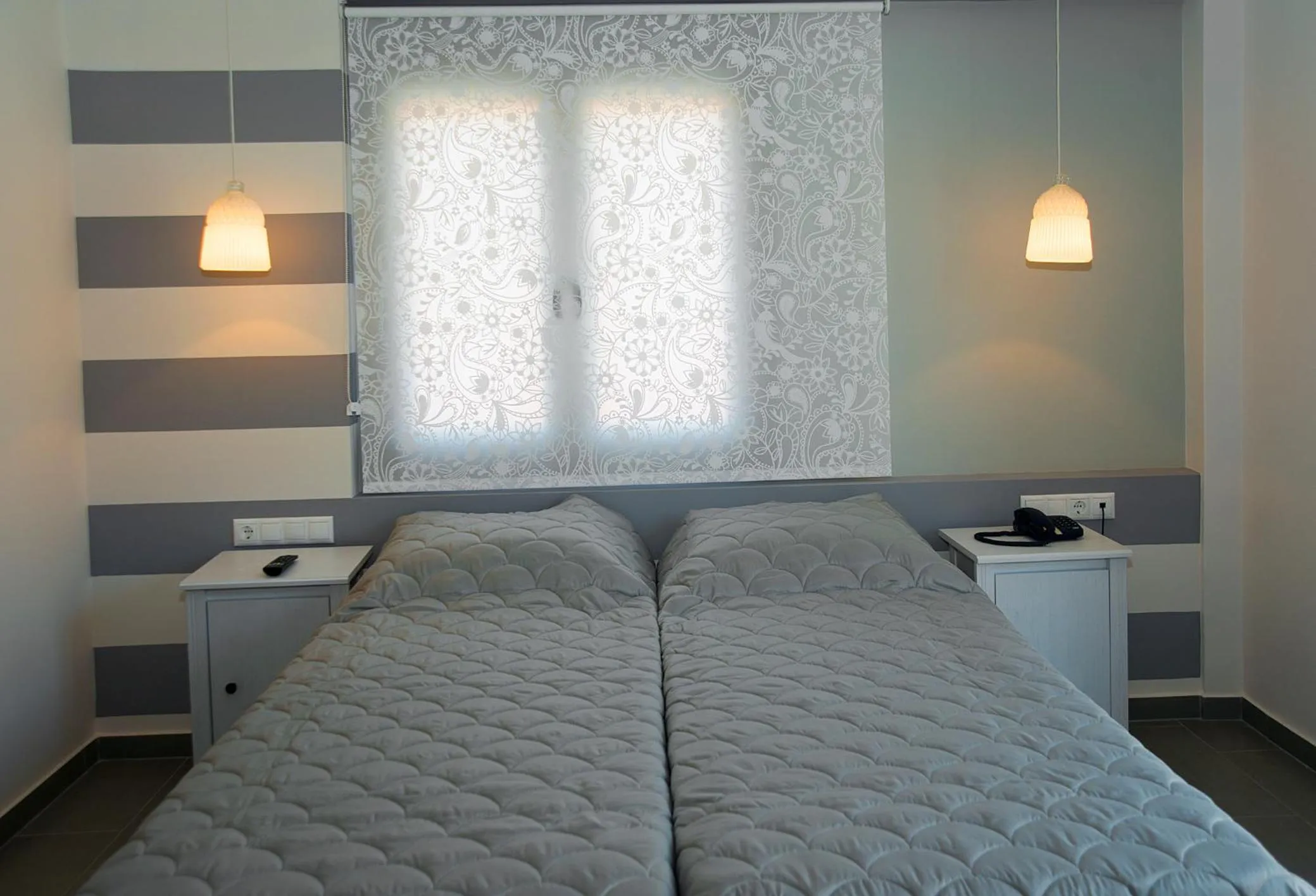 Bed in Dimitra Boutique Hotel