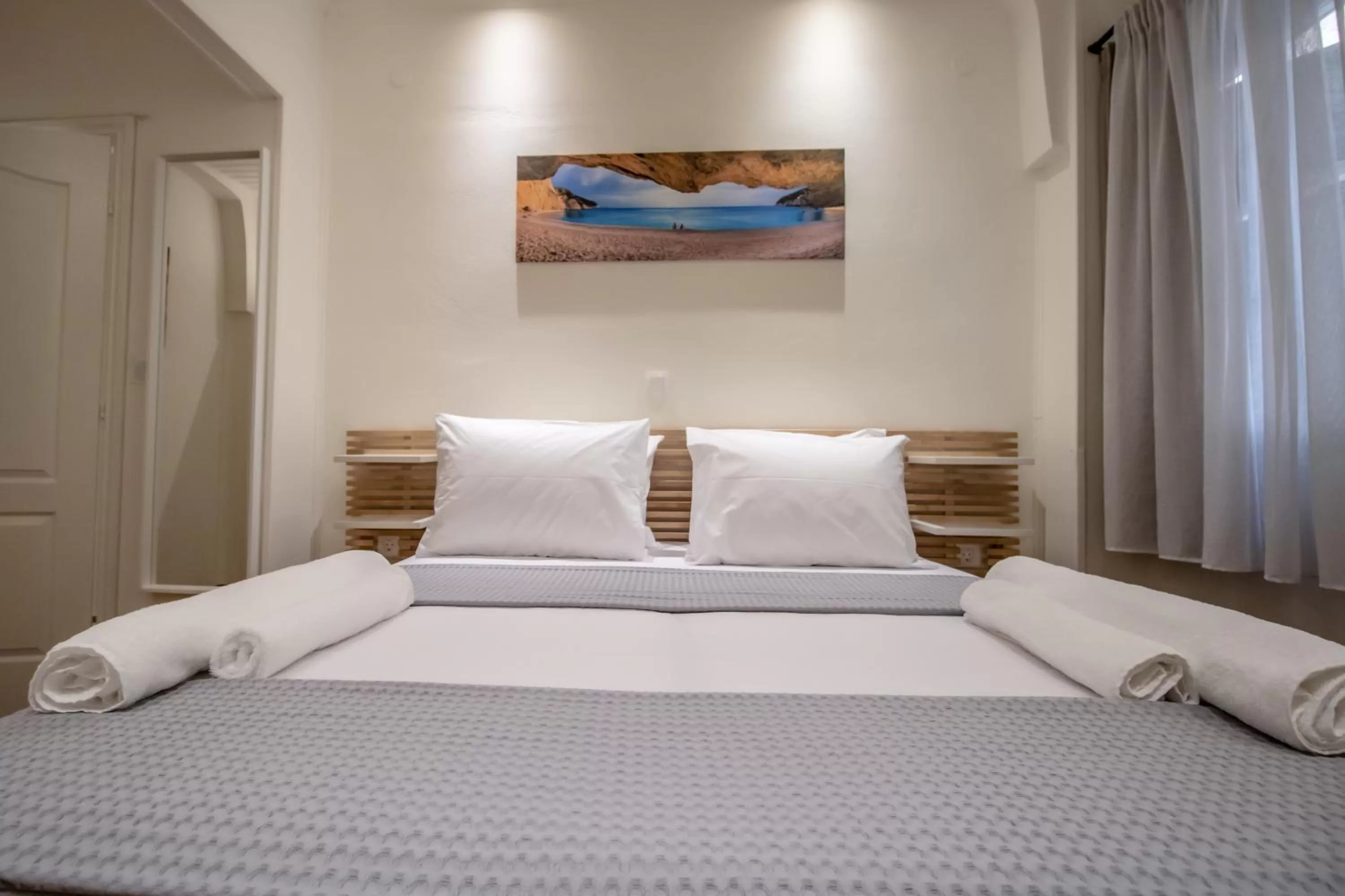 Bed in Levkosh Apartments at Lefkada's Heart
