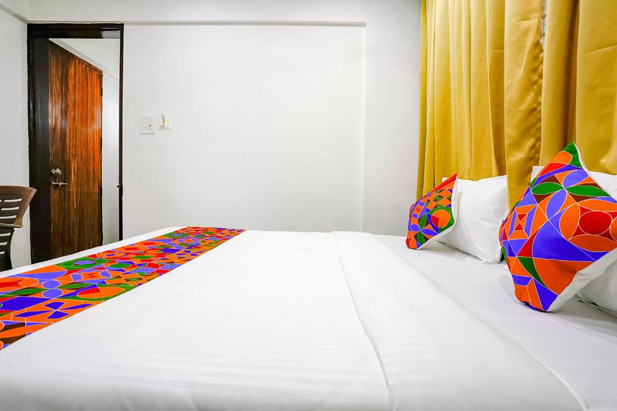 Bed in FabHotel Woods Regency