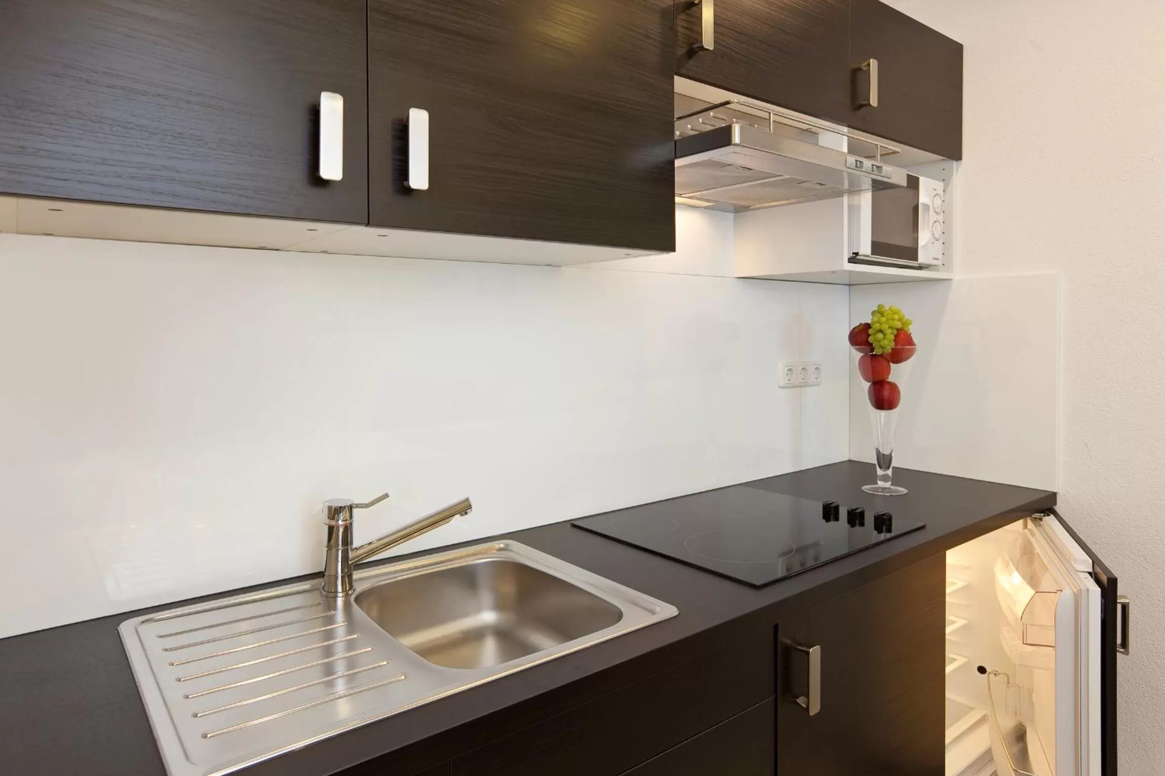 Kitchen or kitchenette in City Apart Hotel Füssen