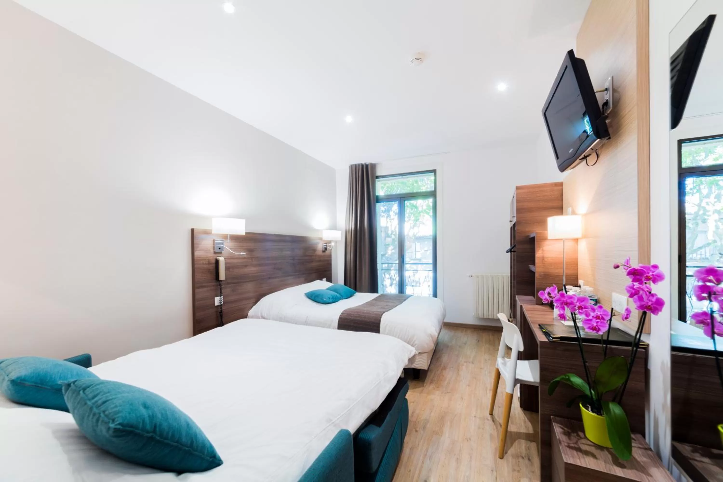 Bedroom, Bed in Logis Hôtel Restaurant Le Cours