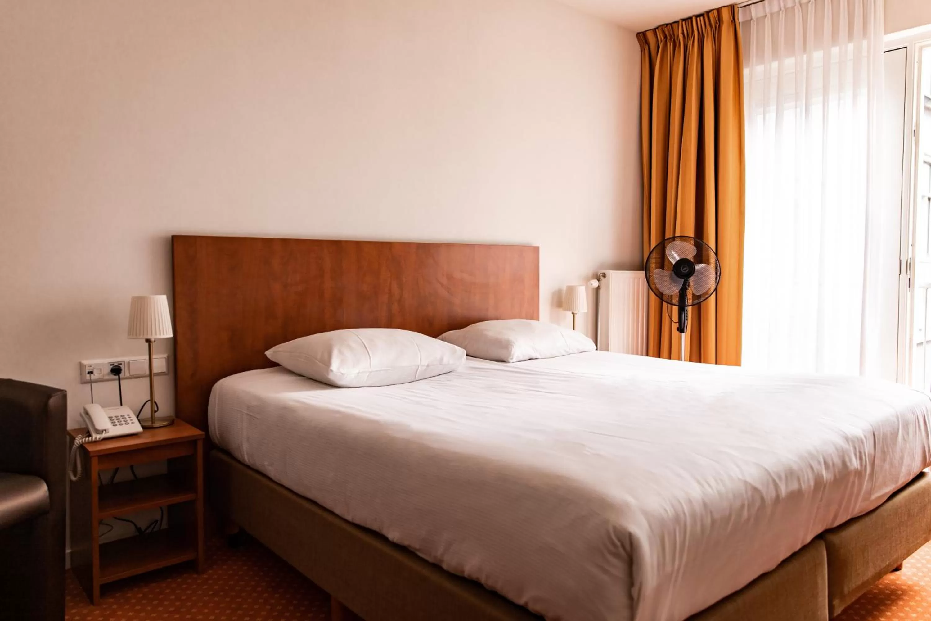 Bed in Ambassador City Centre Hotel