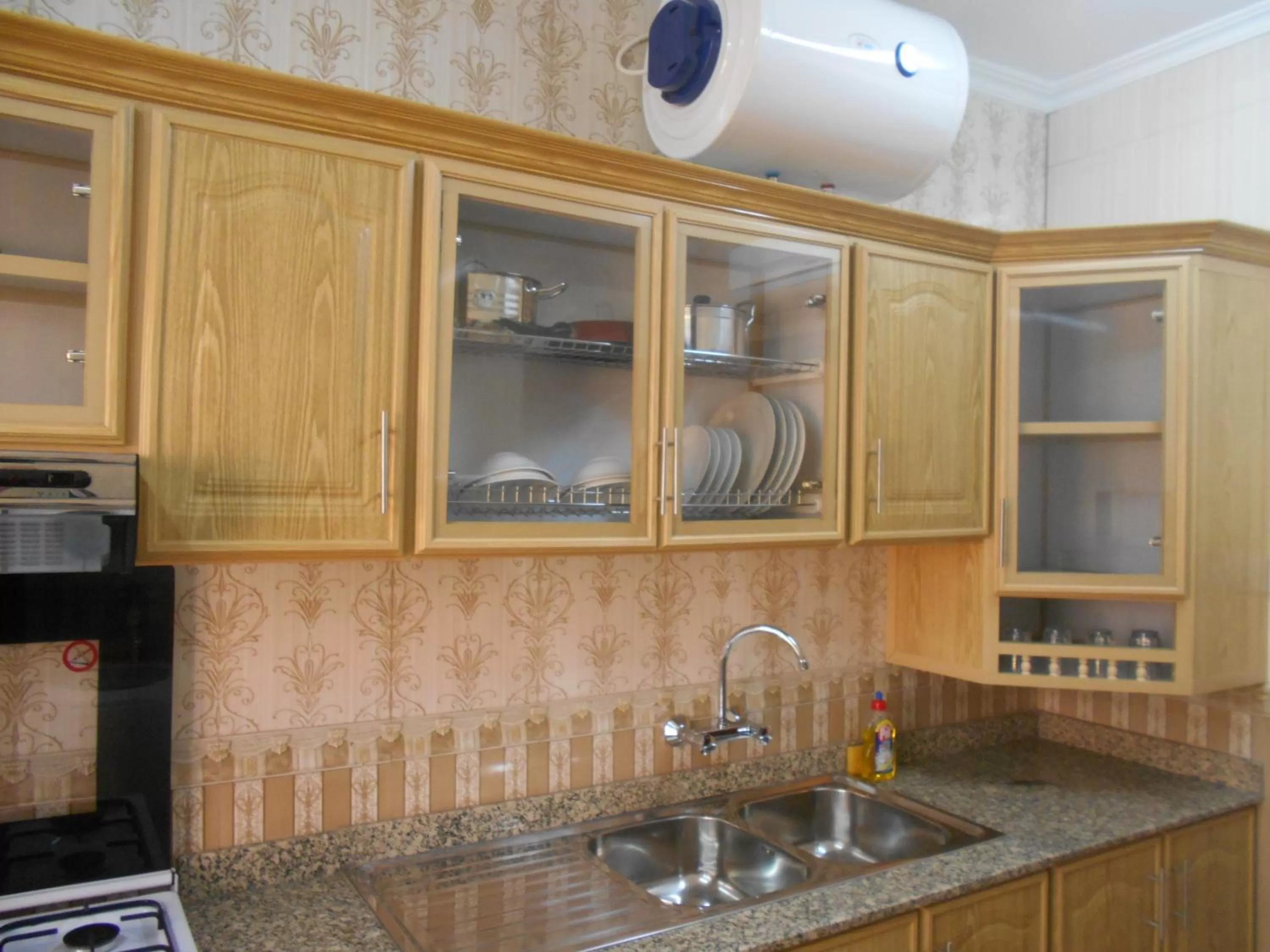 Kitchen or kitchenette in Nizwa Hotel Apartments