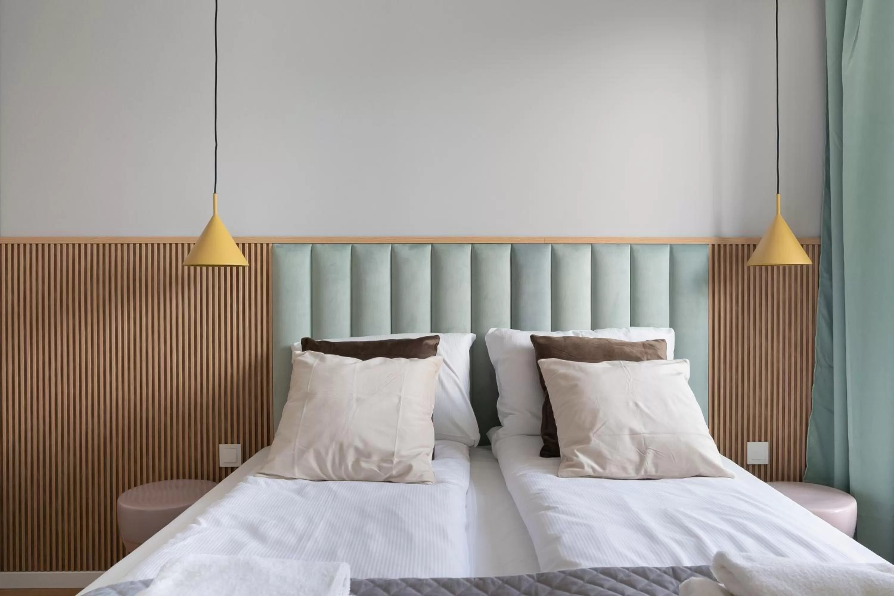 Bed in Symphony Modern Tower Apartamenty