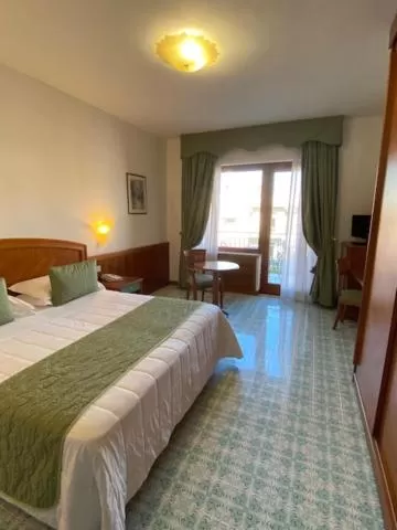 Bed in Grand Hotel Cesare Augusto