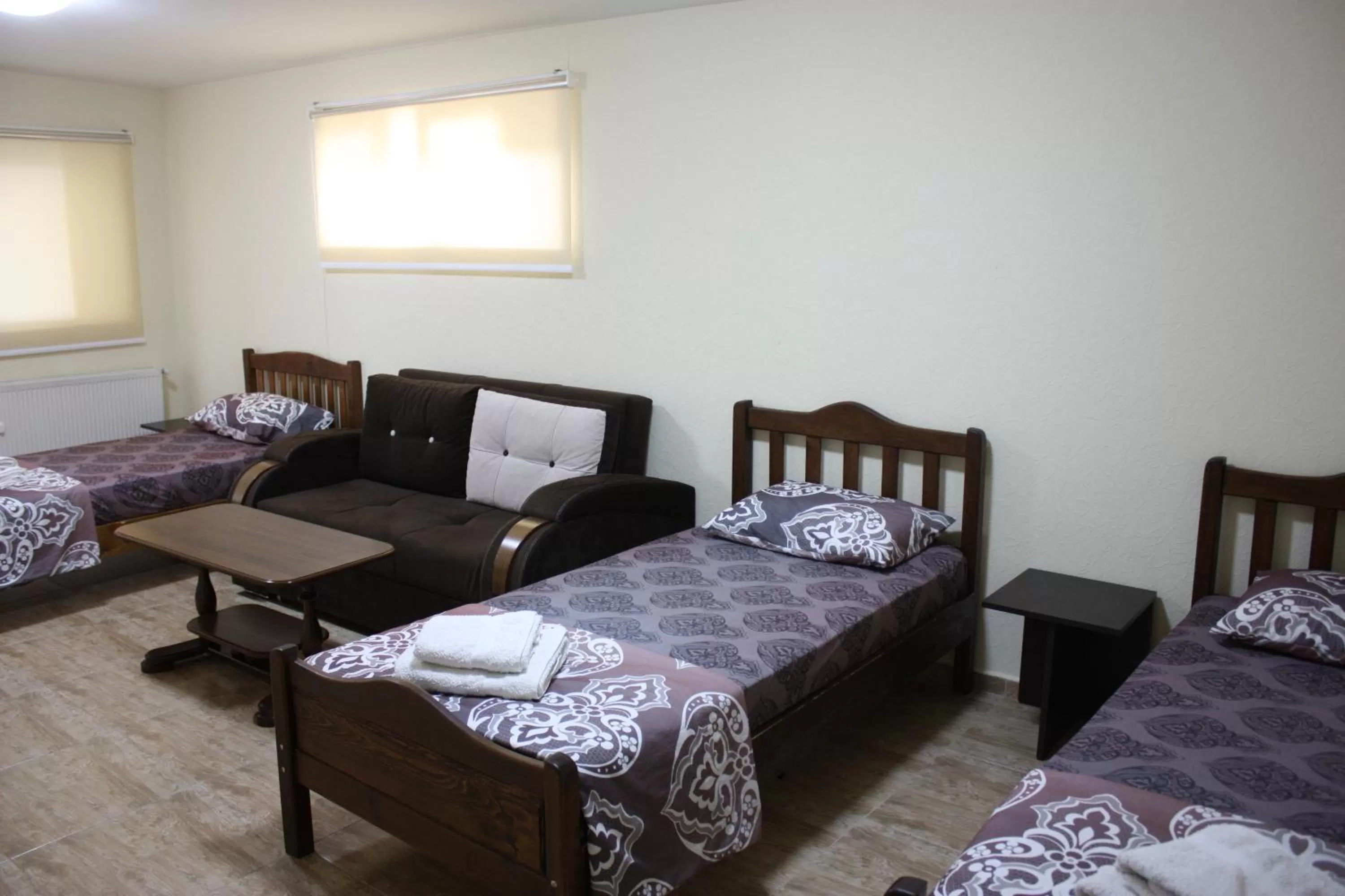 Living room, Bed in Paradise Hotel