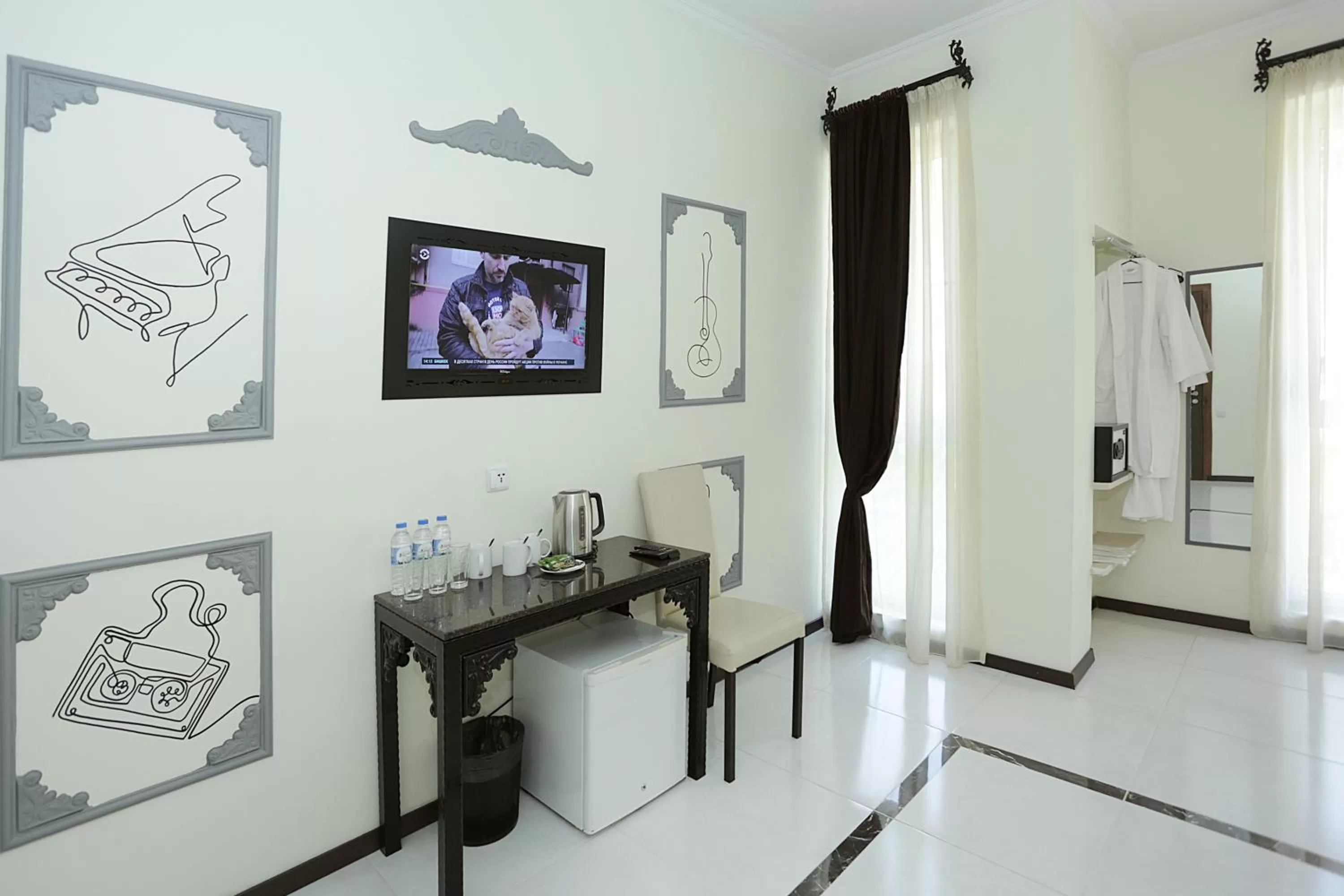 Communal lounge/ TV room in The One Boutique