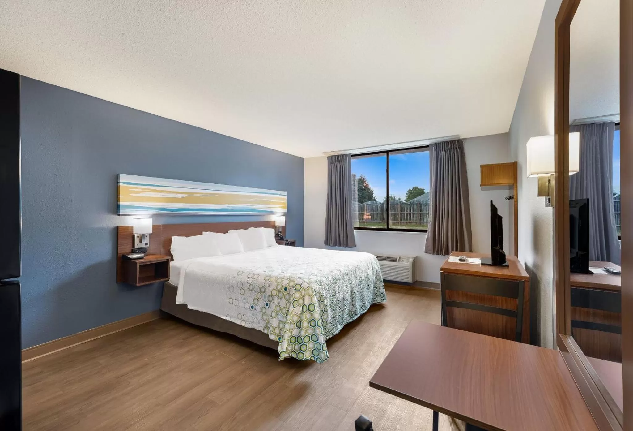 Bedroom, Bed in HomeTowne Studios by Red Roof Painted Post