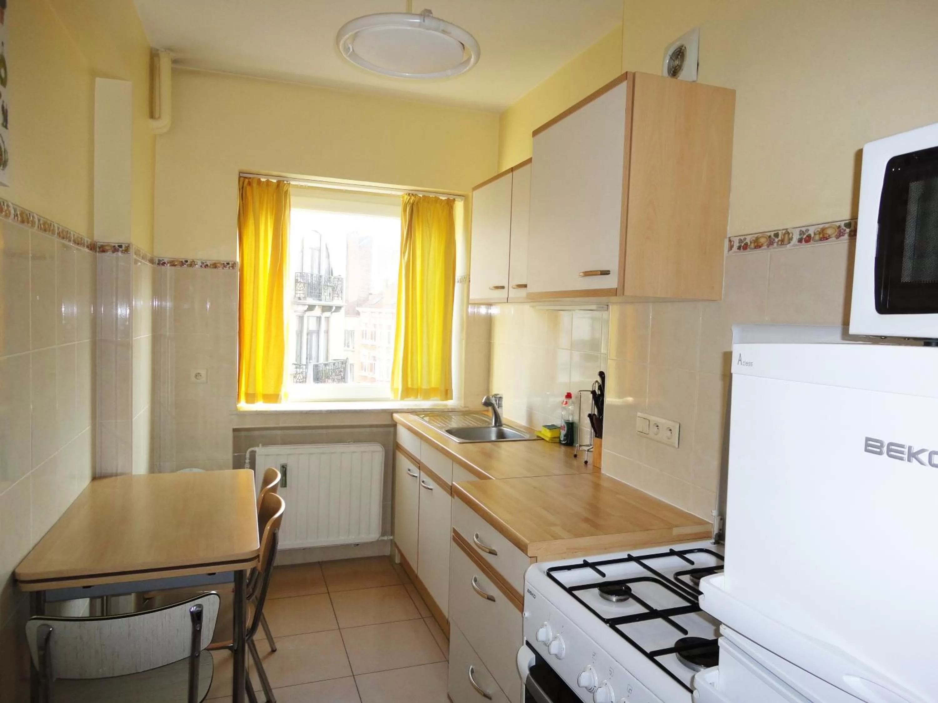 Kitchen or kitchenette in Aparthotel Résidence Bara Midi