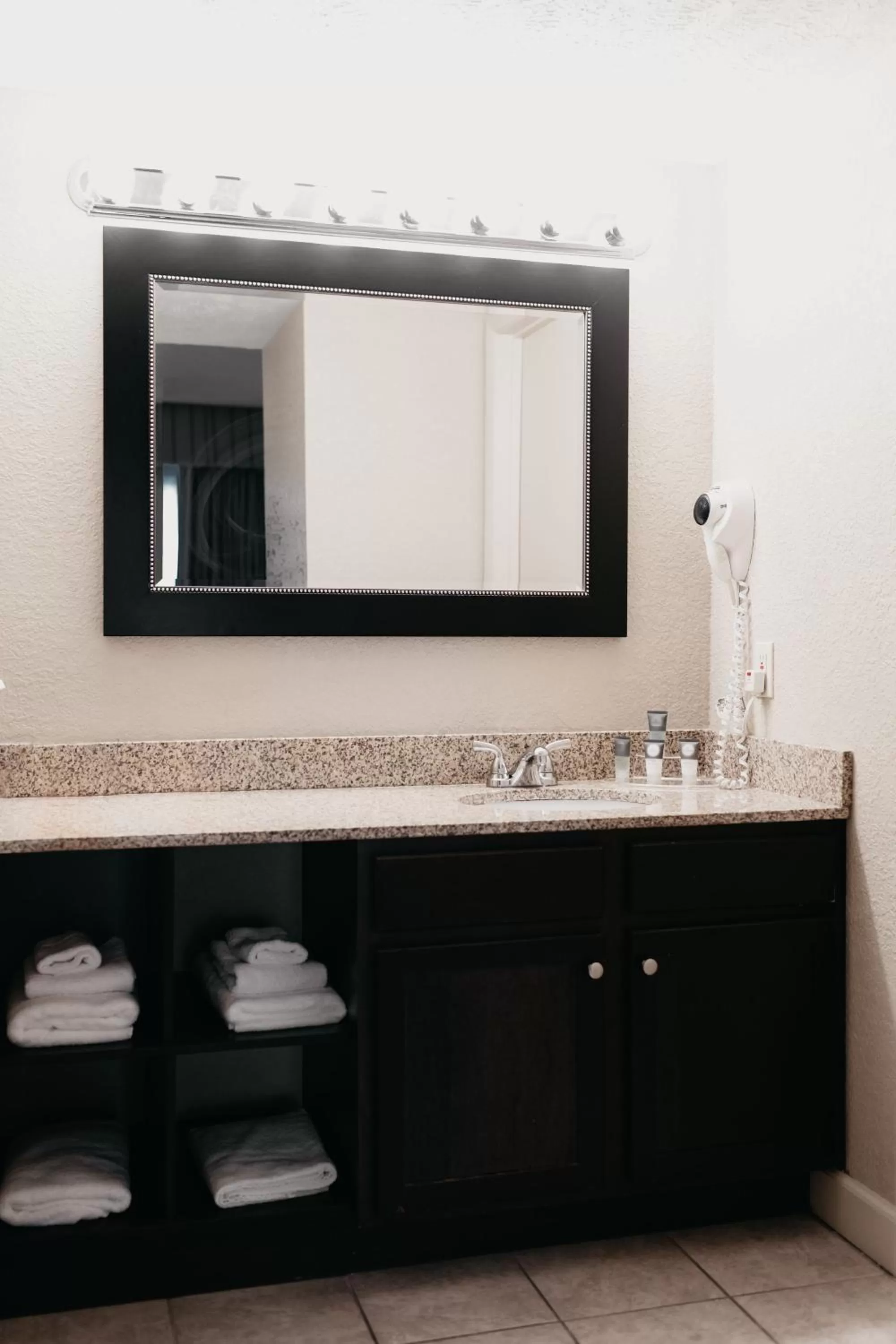 Bathroom in Eastland Suites Hotel & Conference Ctr, Trademark by Wyndham