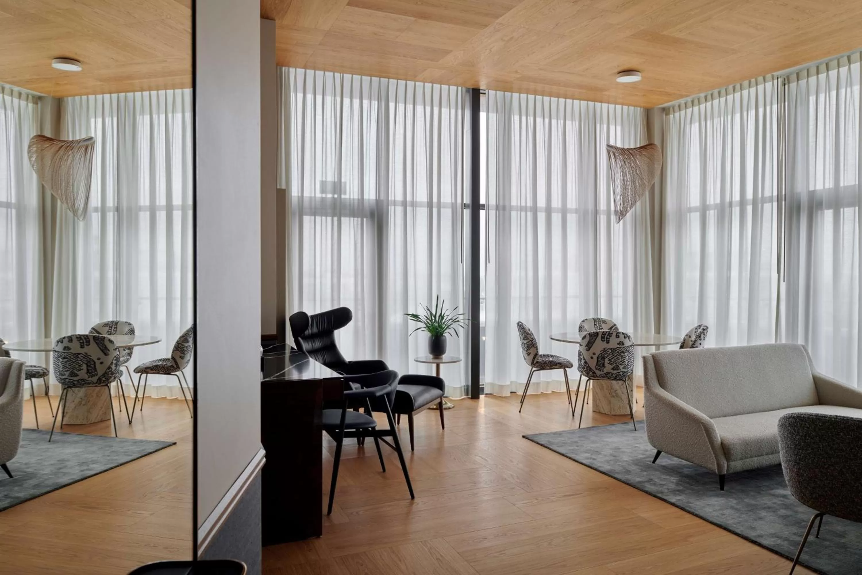 Living room in Iceland Parliament Hotel, Curio Collection By Hilton