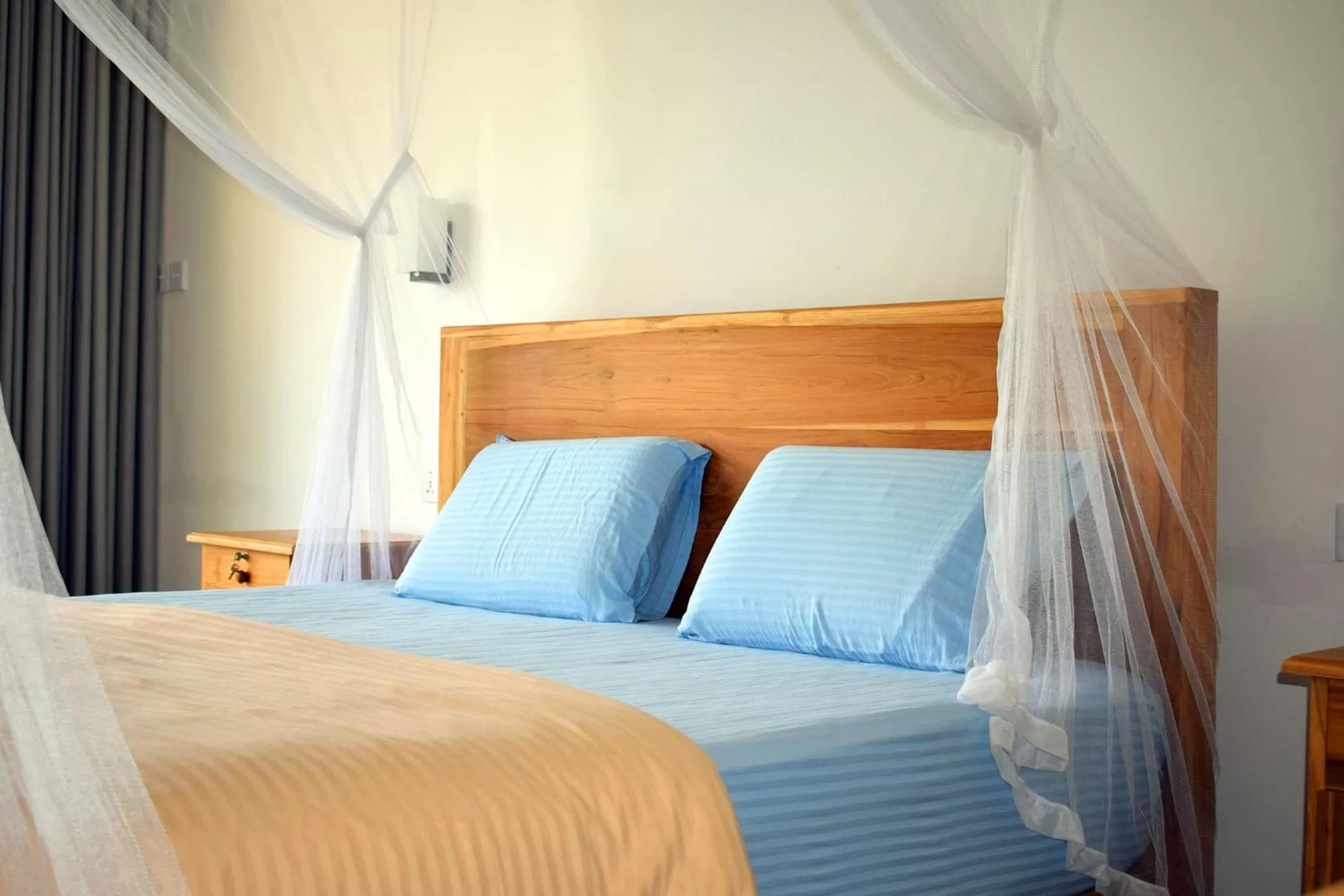 Bed in Raveena Guest House