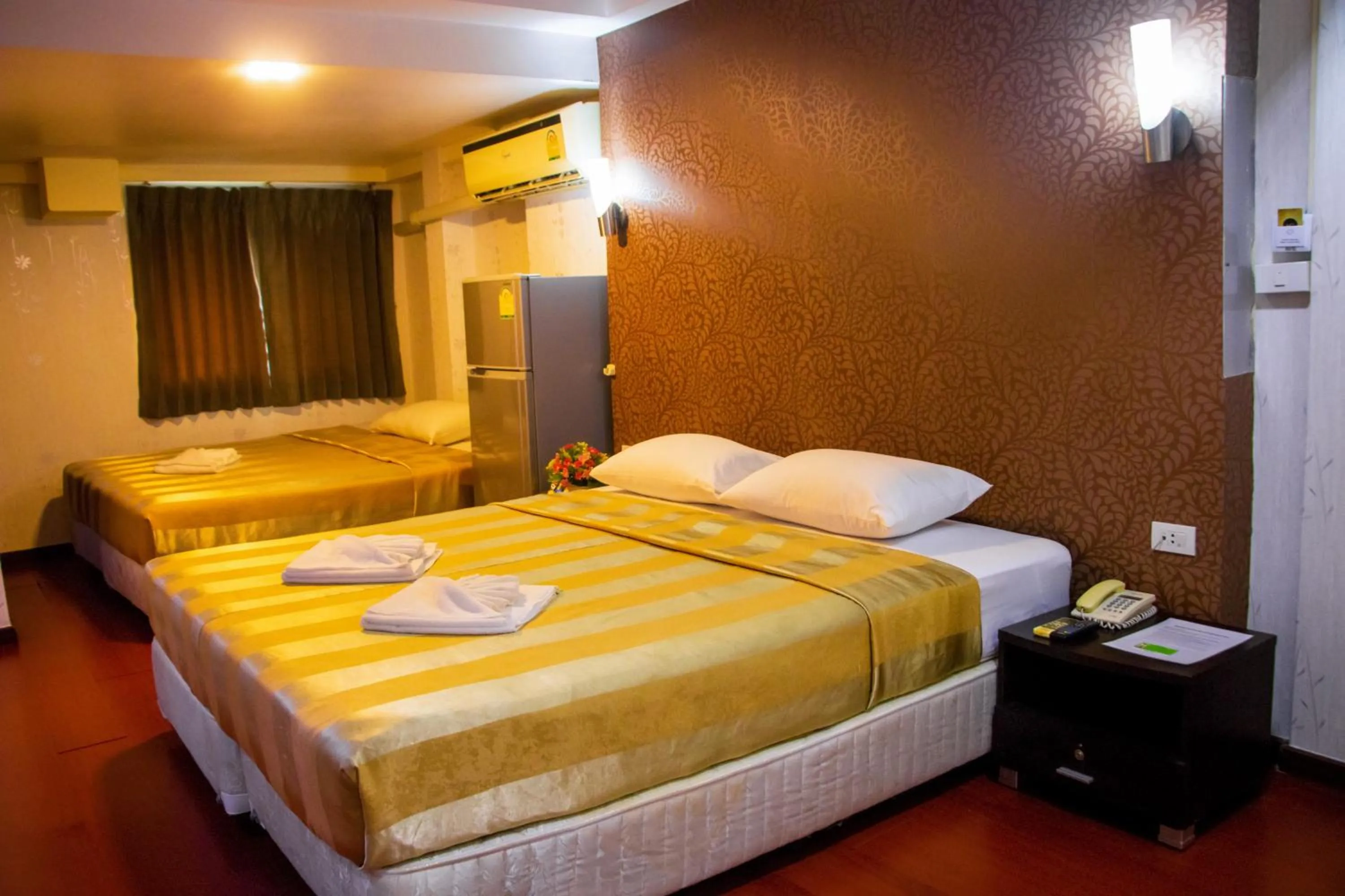 Bed in Visiting Card Hotel & Resort