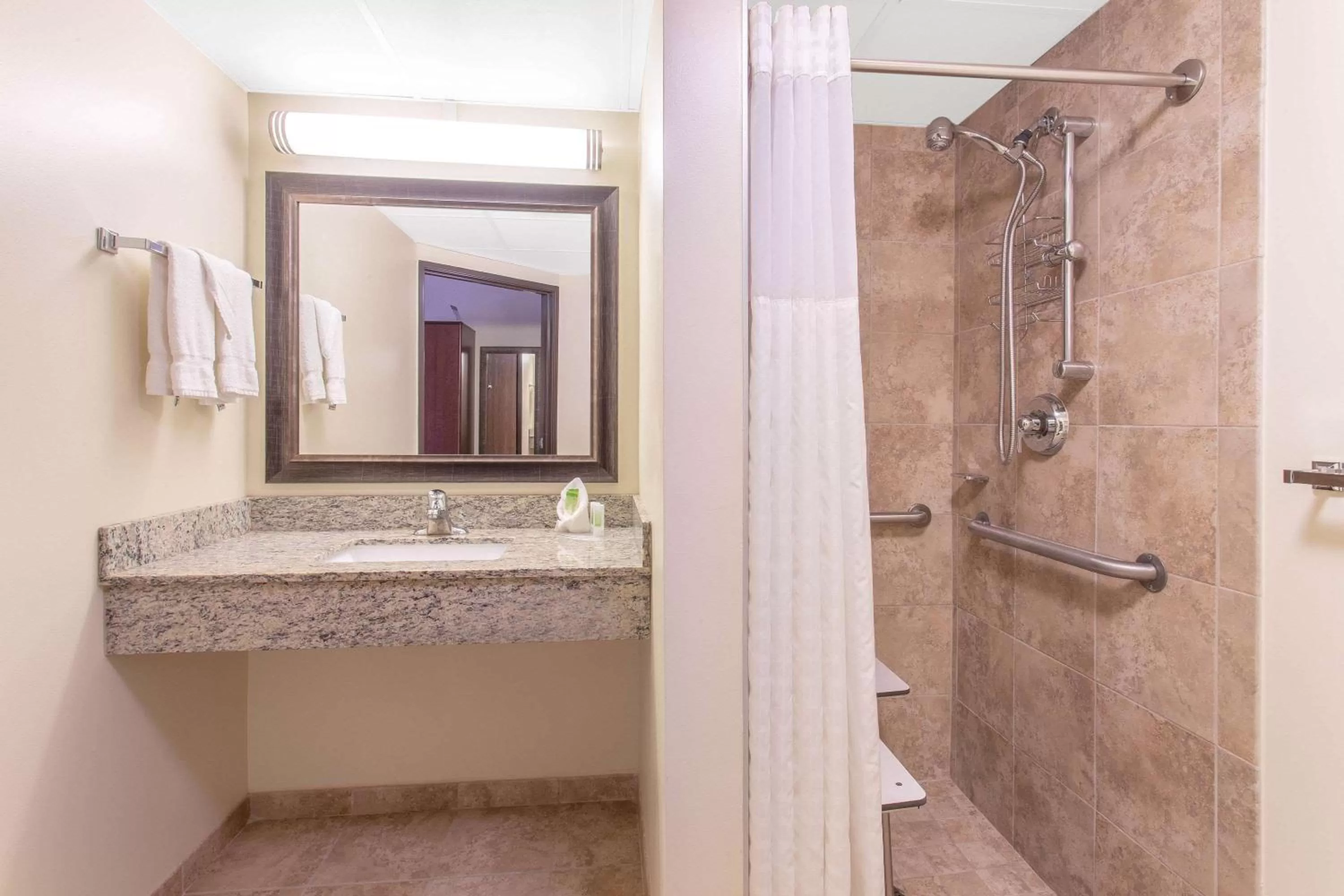 Shower in AmericInn by Wyndham Calumet