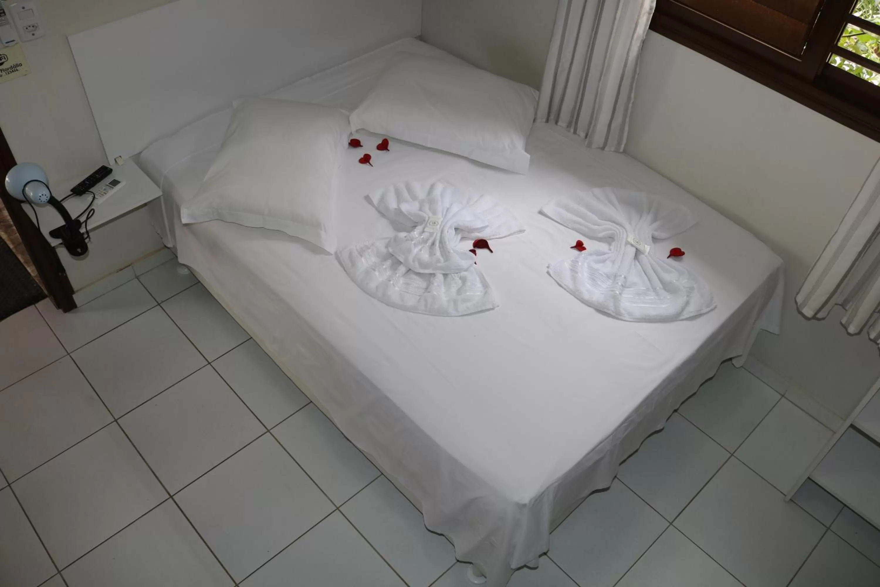 Bed in Pousada Flor Dália