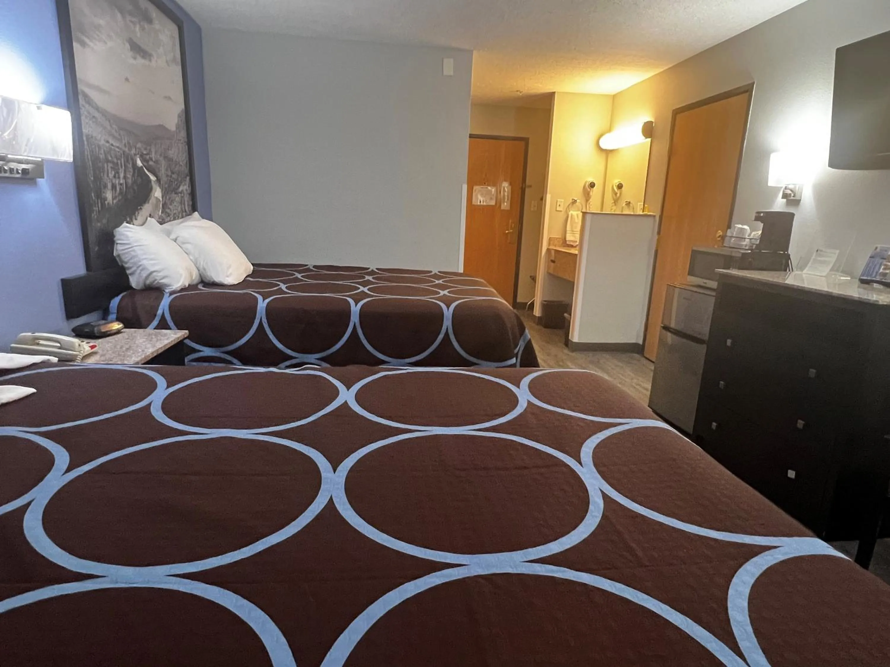 Bed in Super 8 by Wyndham Cleveland TX