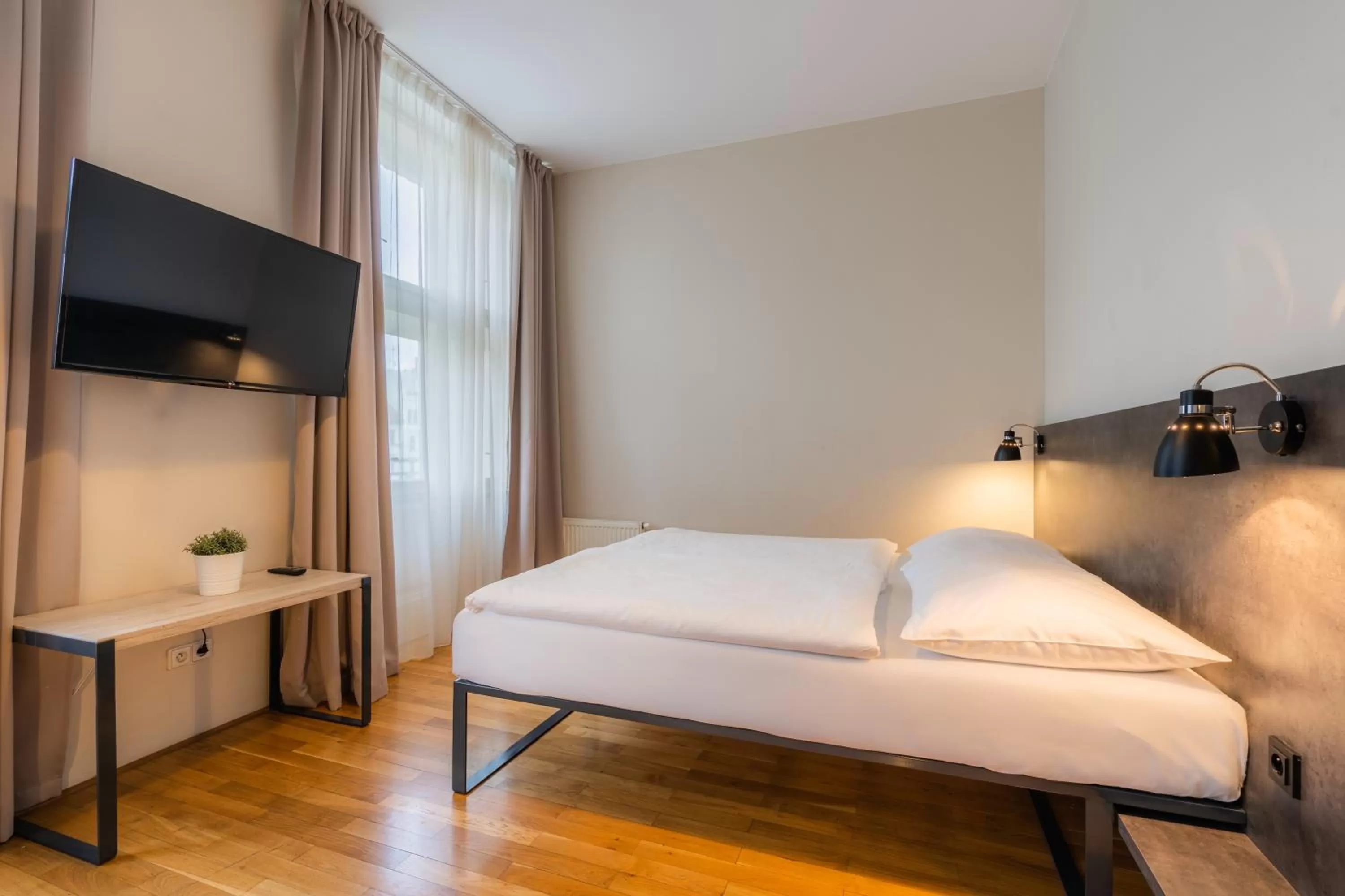 Bed in EA ApartHotel Melantrich