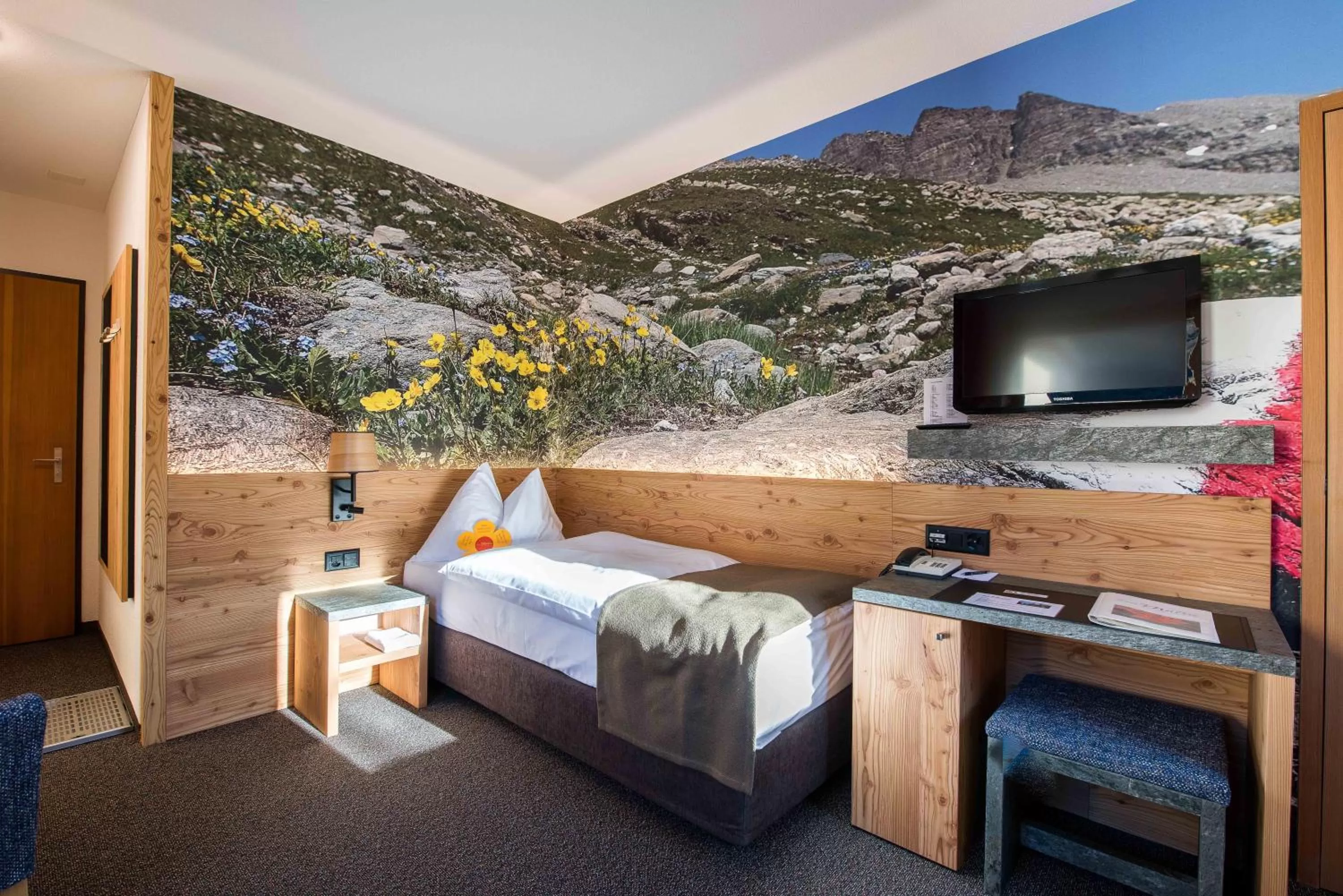 Bed in Hotel Garni Chesa Mulin