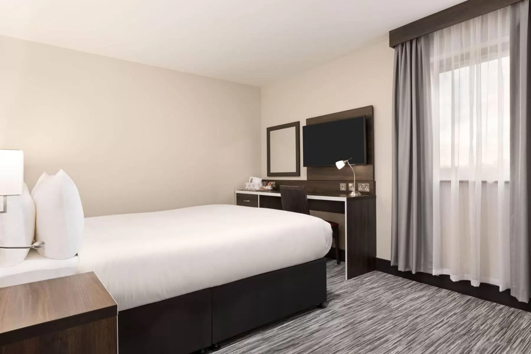 Bed in Ramada by Wyndham Cobham