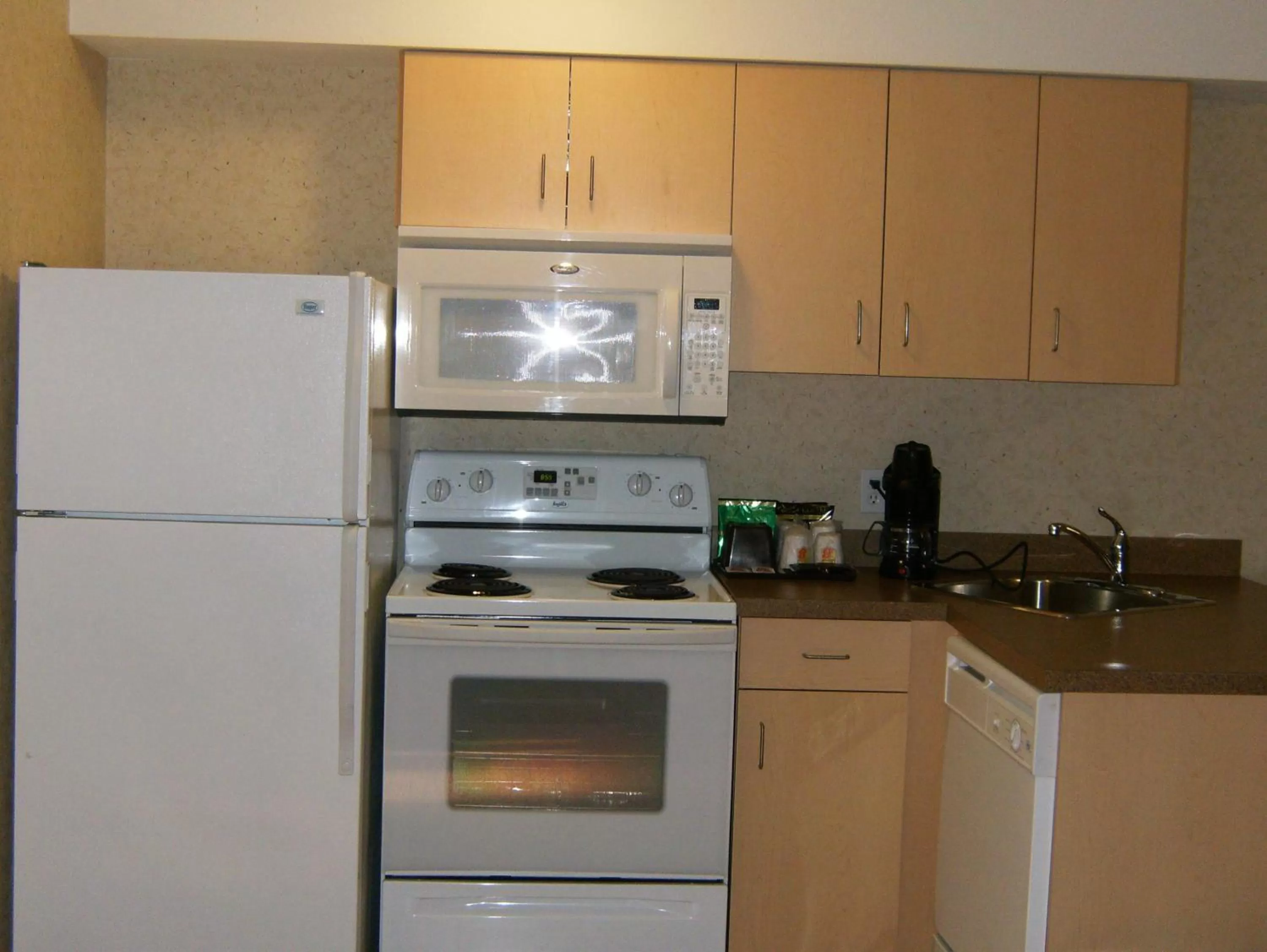 Kitchen or kitchenette in Super 8 by Wyndham Grande Prairie