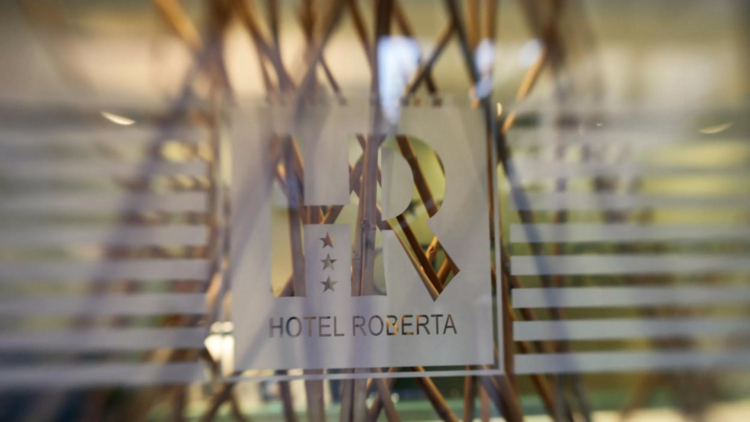 Property logo or sign in Hotel Roberta