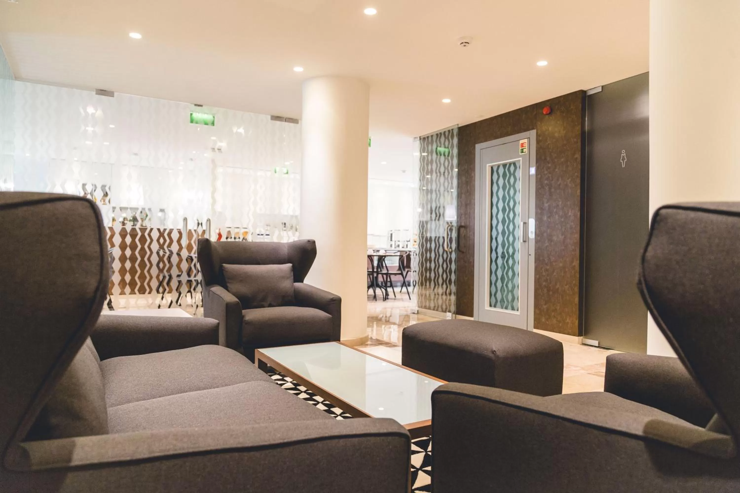 Communal lounge/ TV room in Hotel Aveiro Center by Alboi Group