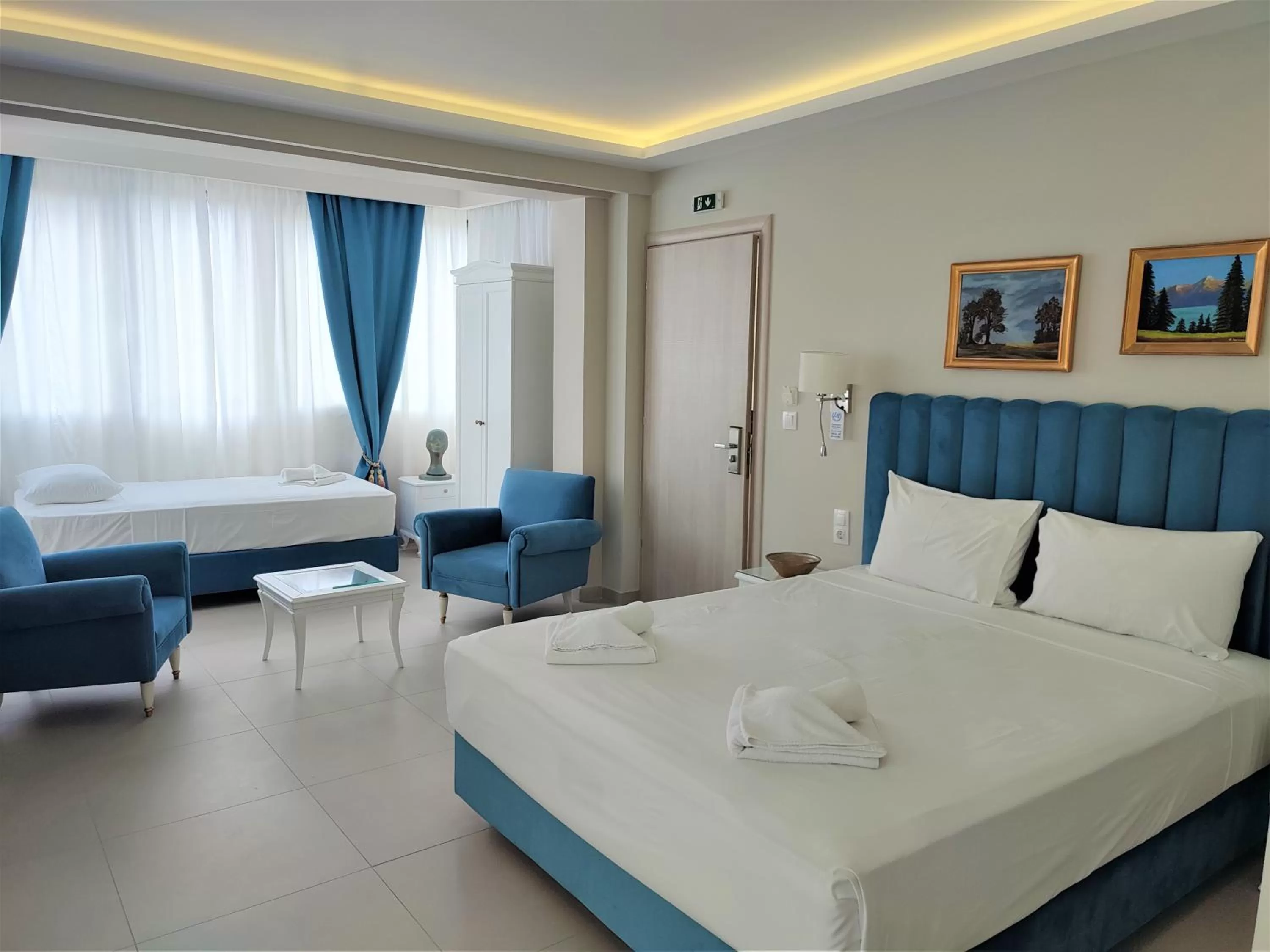 Bed in Light Blue Hotel