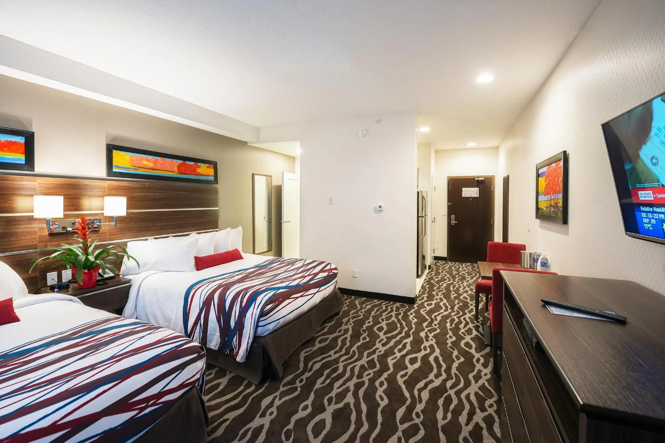 Photo of the whole room, Bed in Encore Suites by Service Plus Inns