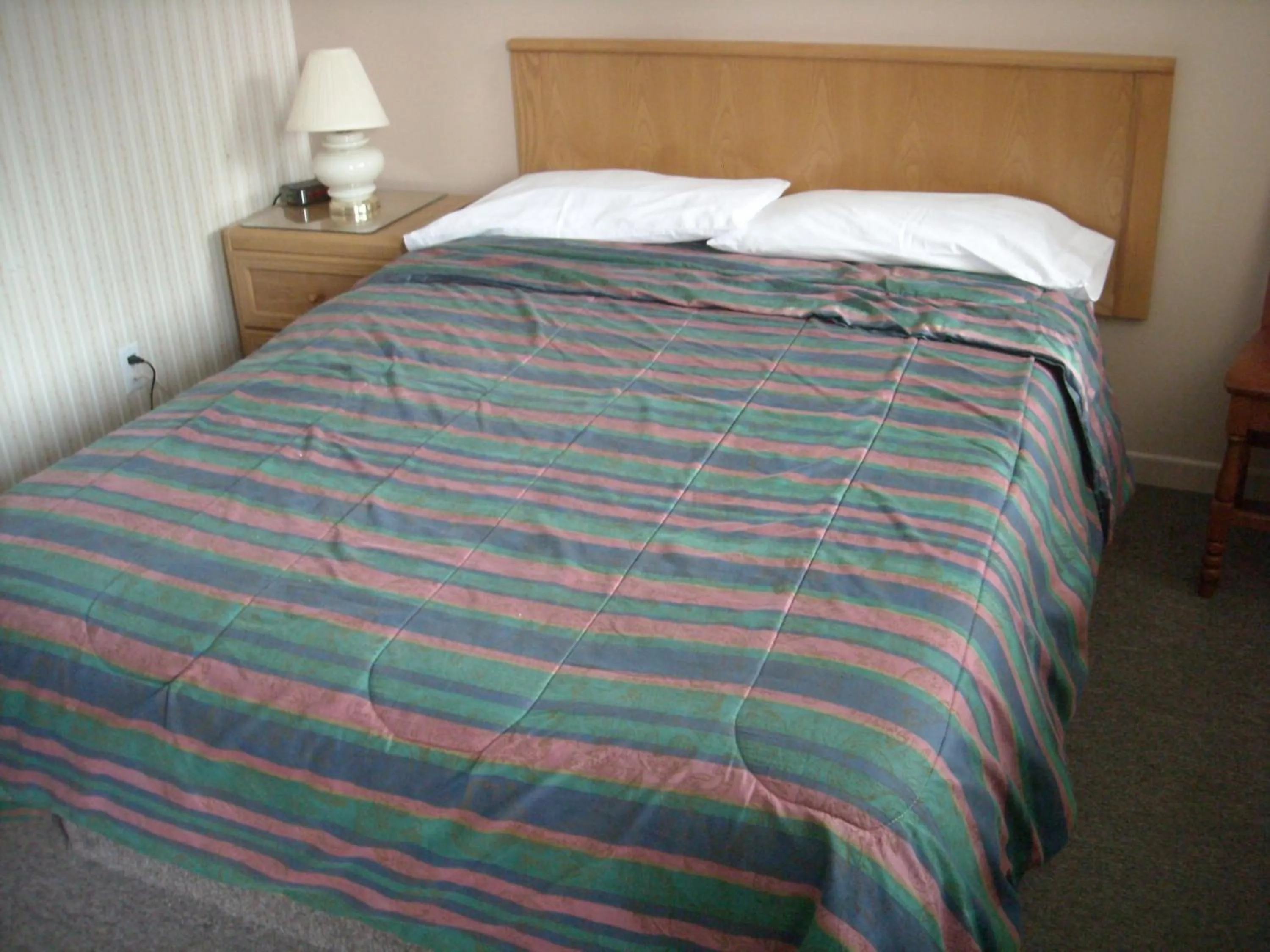 Bed in Motel le Verseau