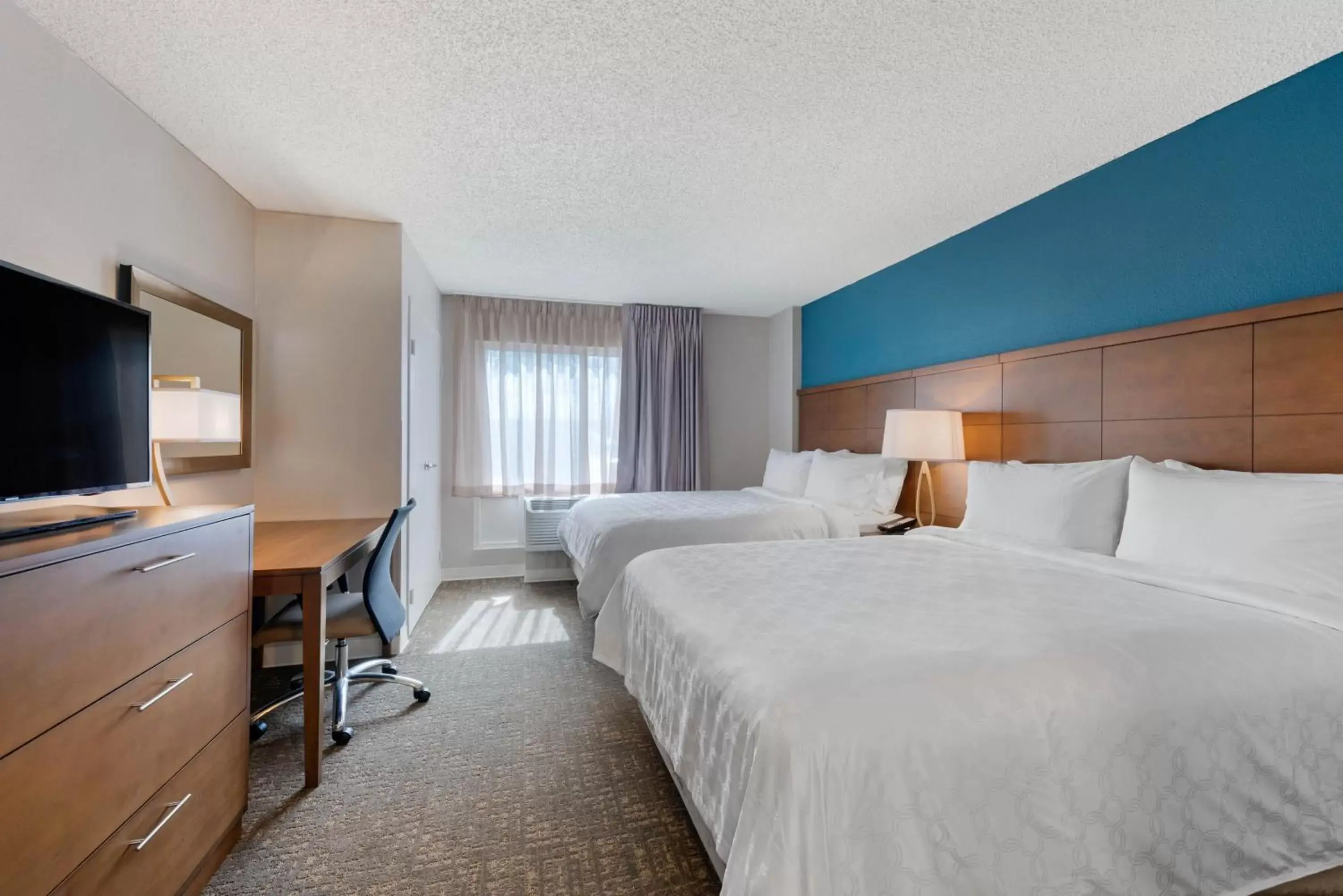 Two-Bedroom Suite with One King and Two Queen Beds in Staybridge Suites Orlando Royale Parc Suites by IHG Two-Bedroom Suite with One King and Two Queen Beds in Staybridge Suites Orlando Royale Parc Suites by IHG