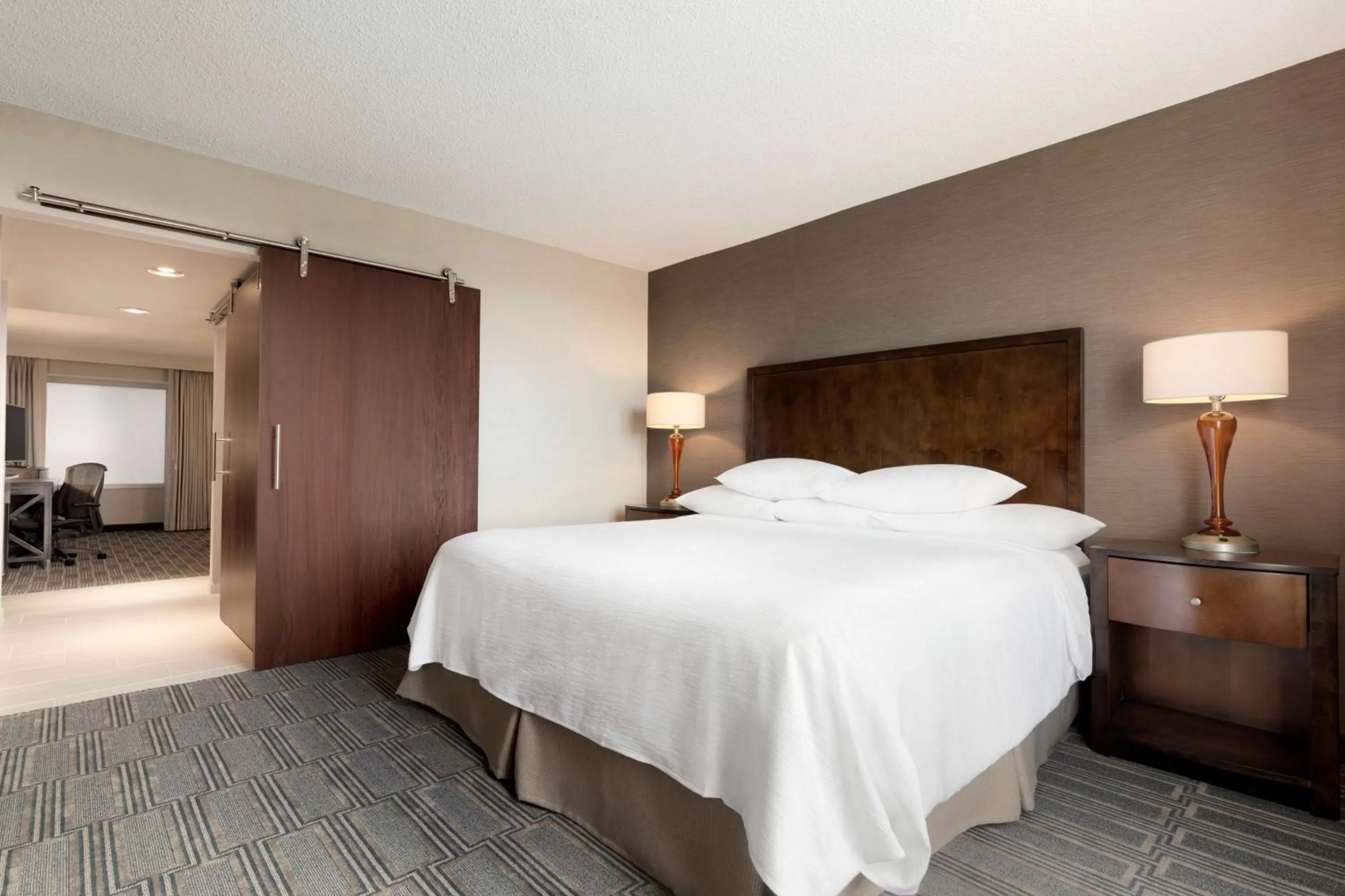 Bed in Embassy Suites by Hilton Chicago Lombard
