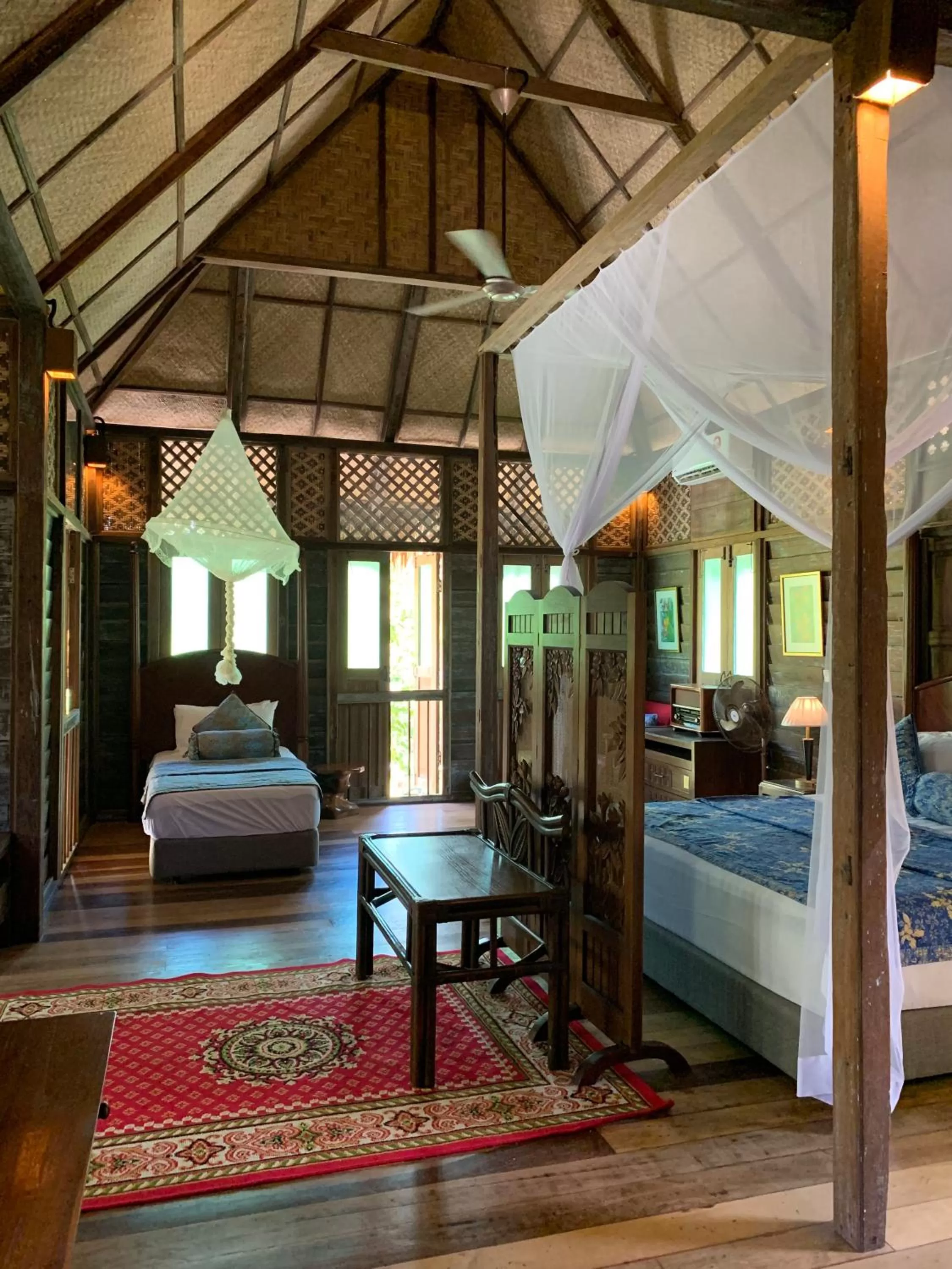 Bed in Kunang Kunang Heritage Villas