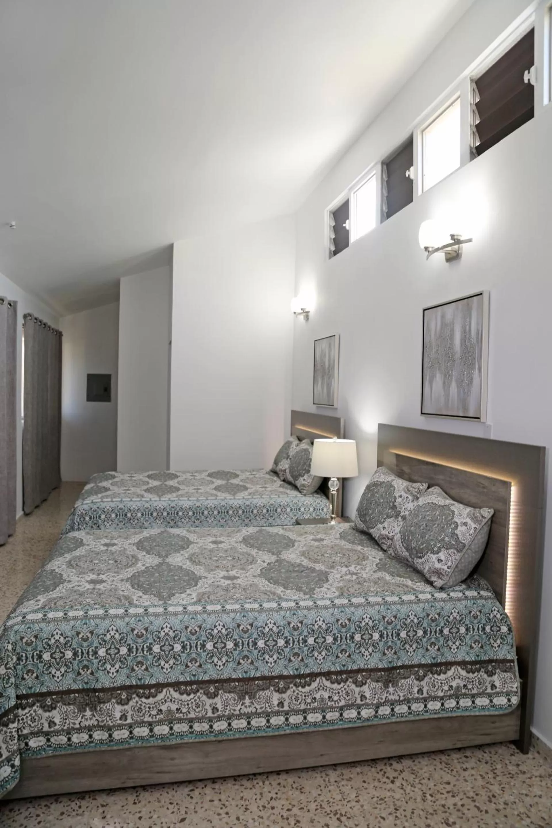 Bed in Itza-Bella Suites