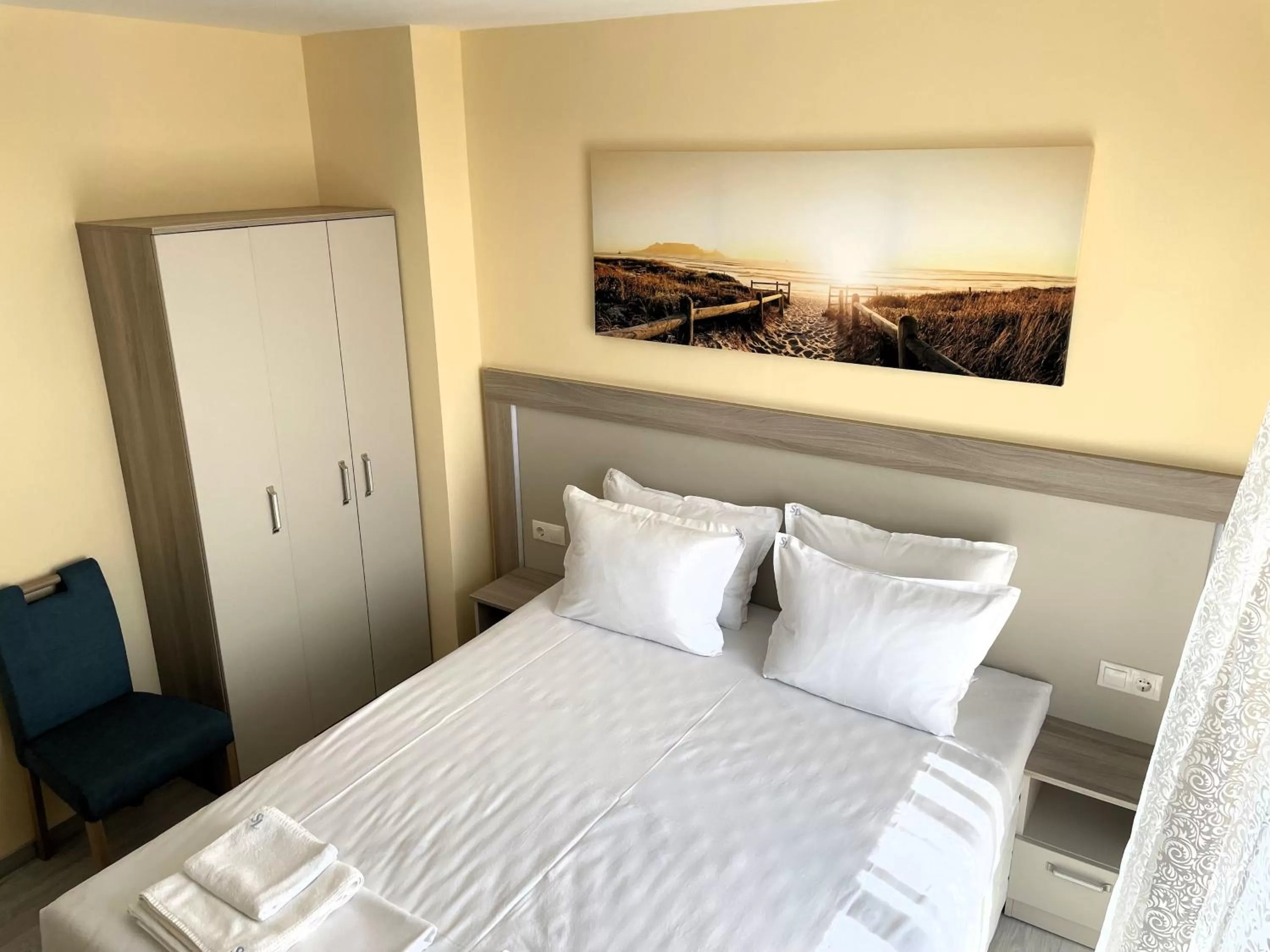 Bed in APART-HOTEL Stamopolu Lux с изглед към морето