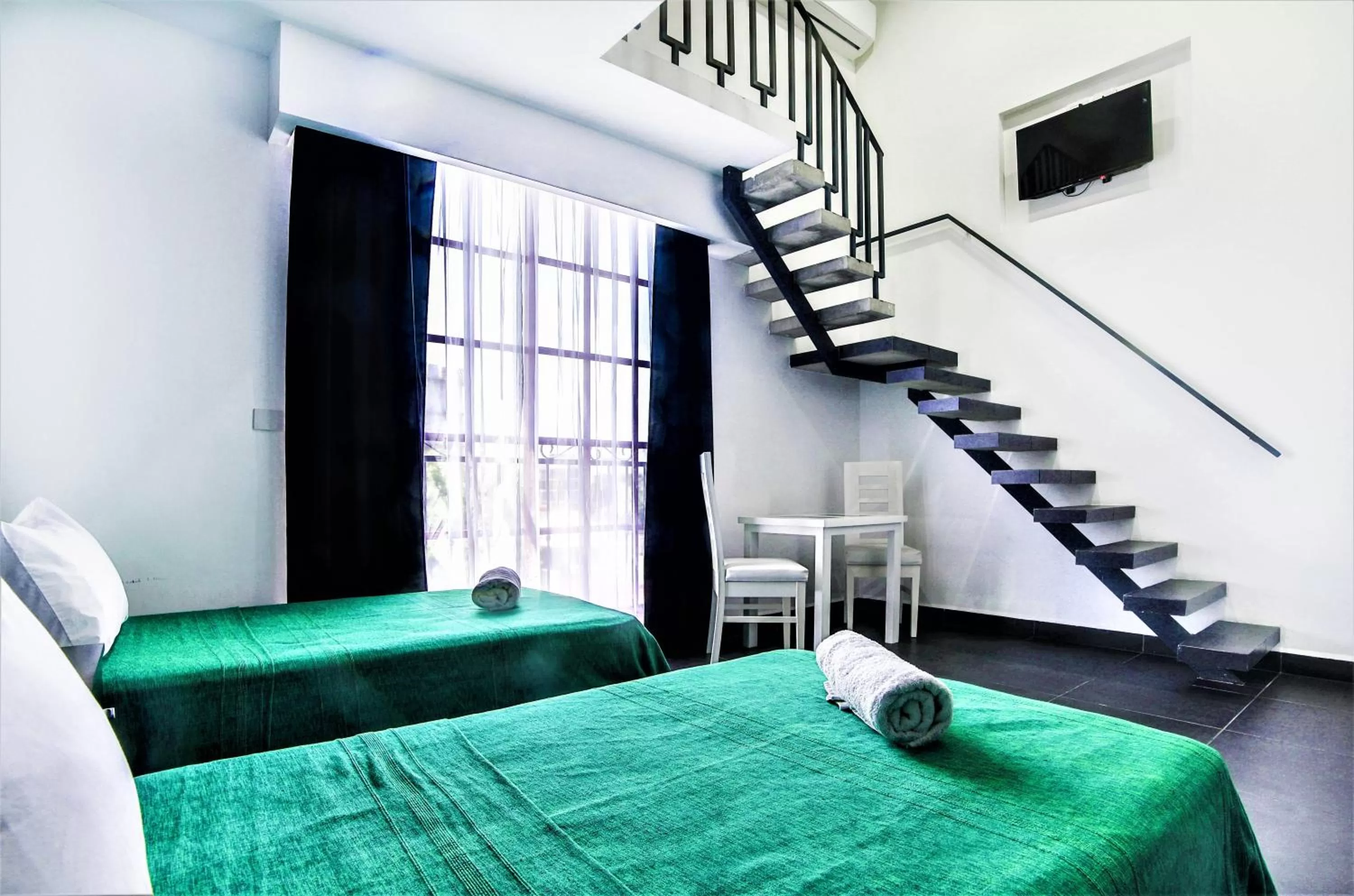 Photo of the whole room, Bed in Hotel Colonial Playa del Carmen