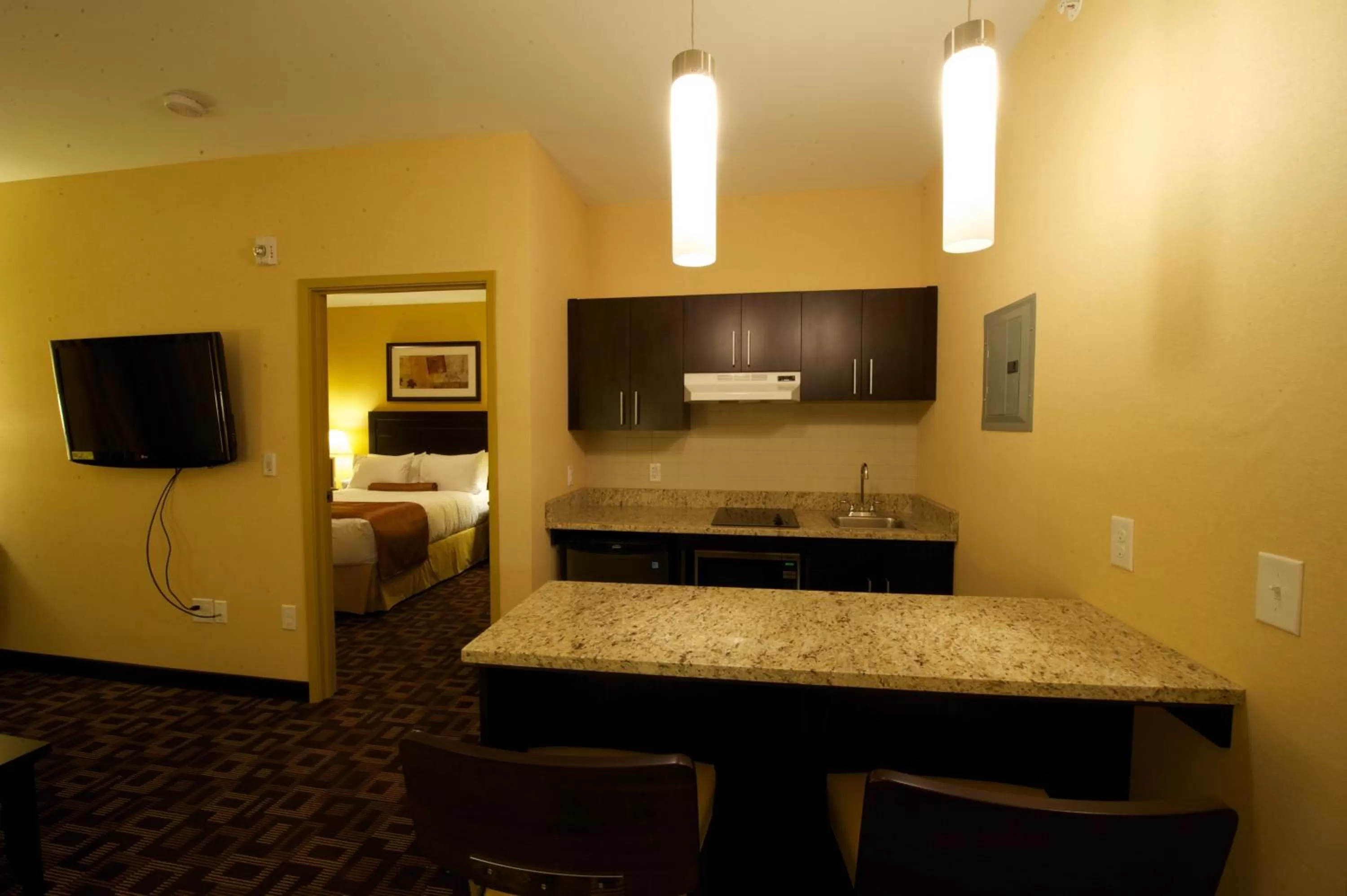 Kitchen or kitchenette in Days Inn & Suites by Wyndham Winnipeg Airport Manitoba
