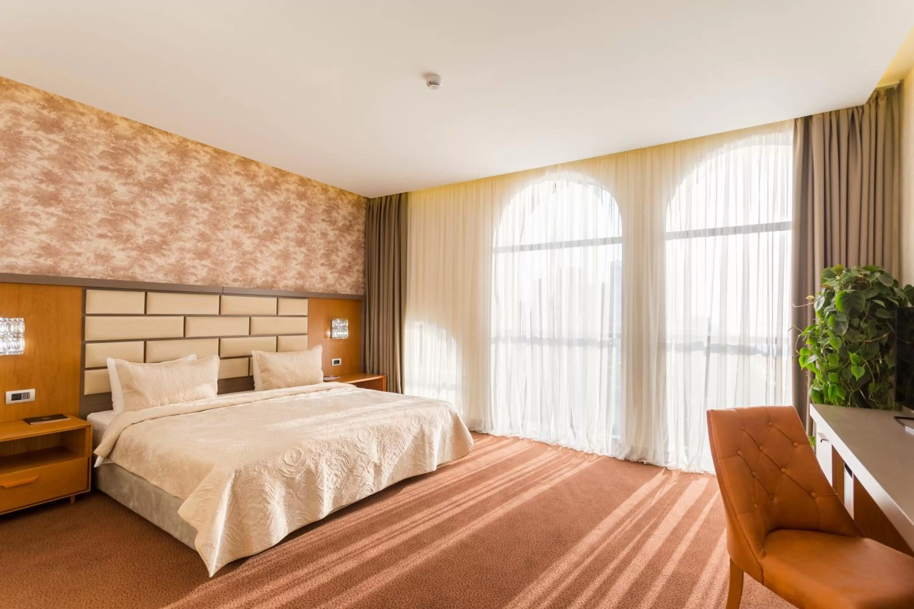 Bed in The Grand Gloria Hotel