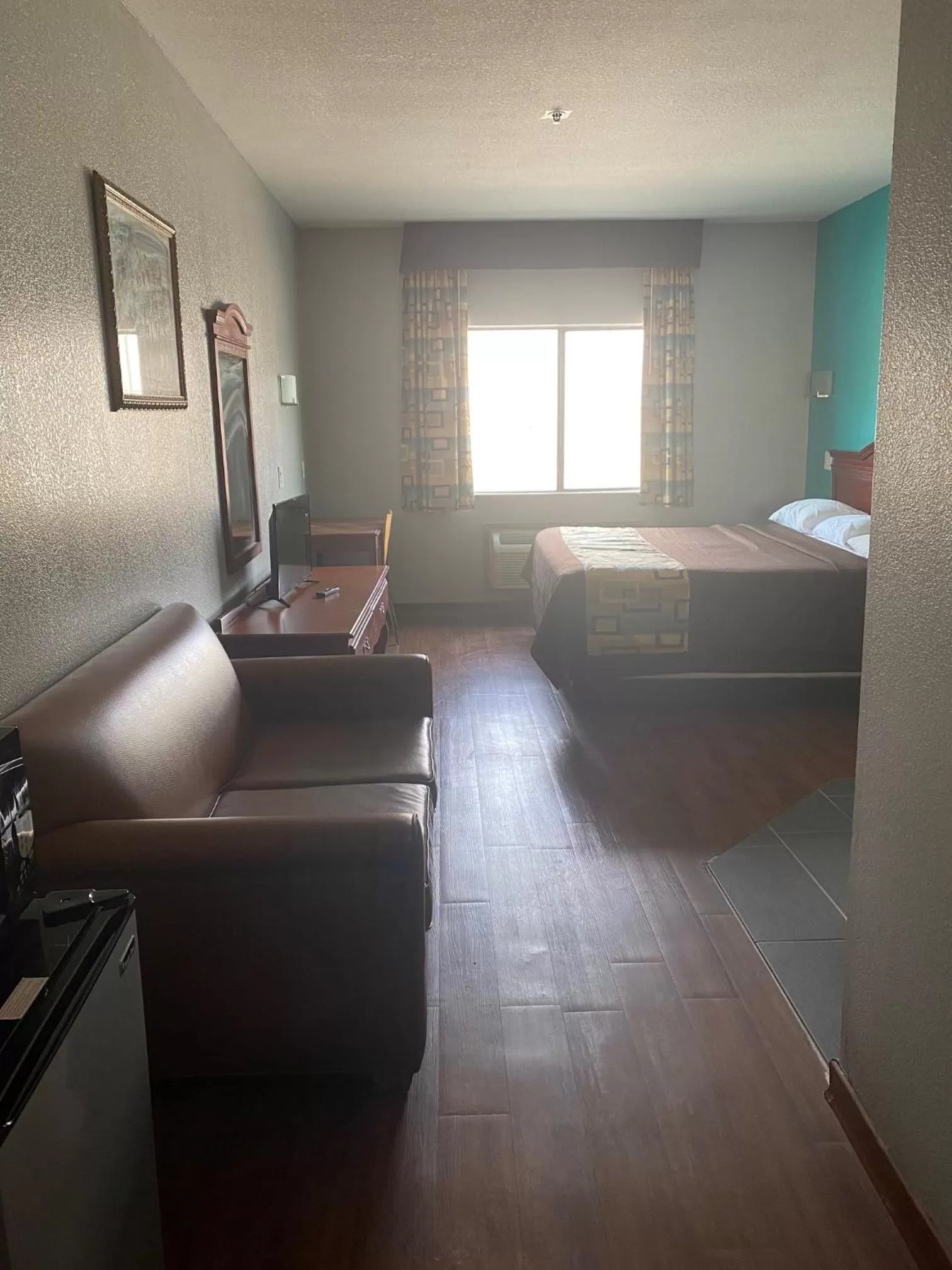 Bed in Tropicana Inn and Suites