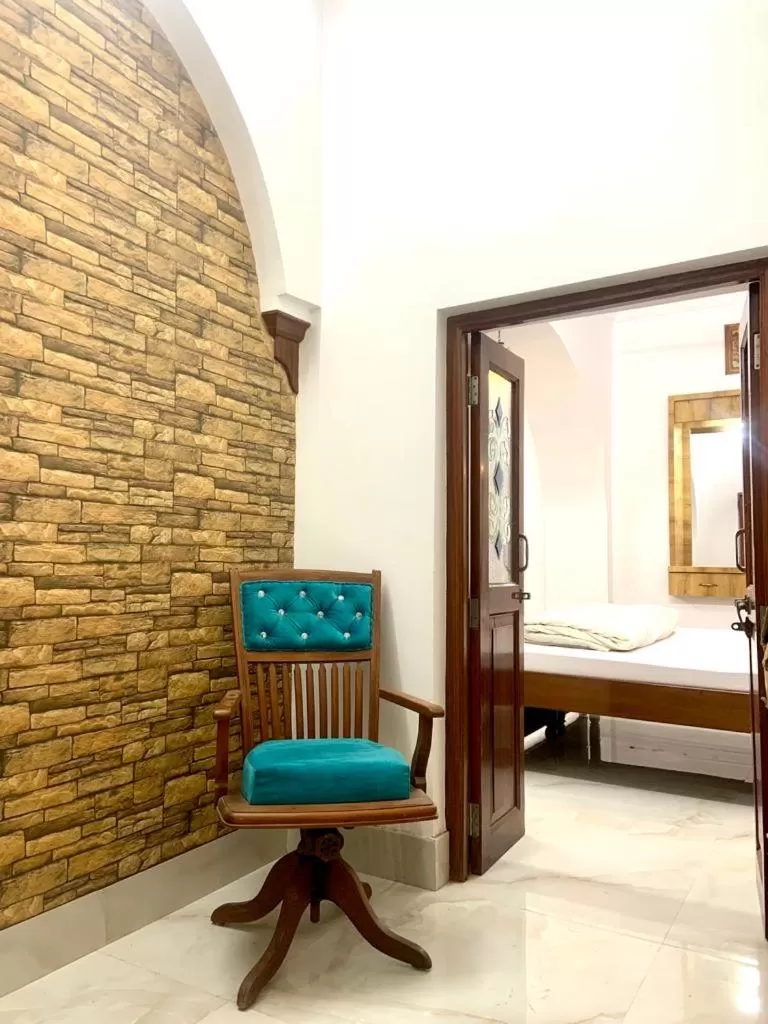 Seating area, Bed in Hotel Swagatam