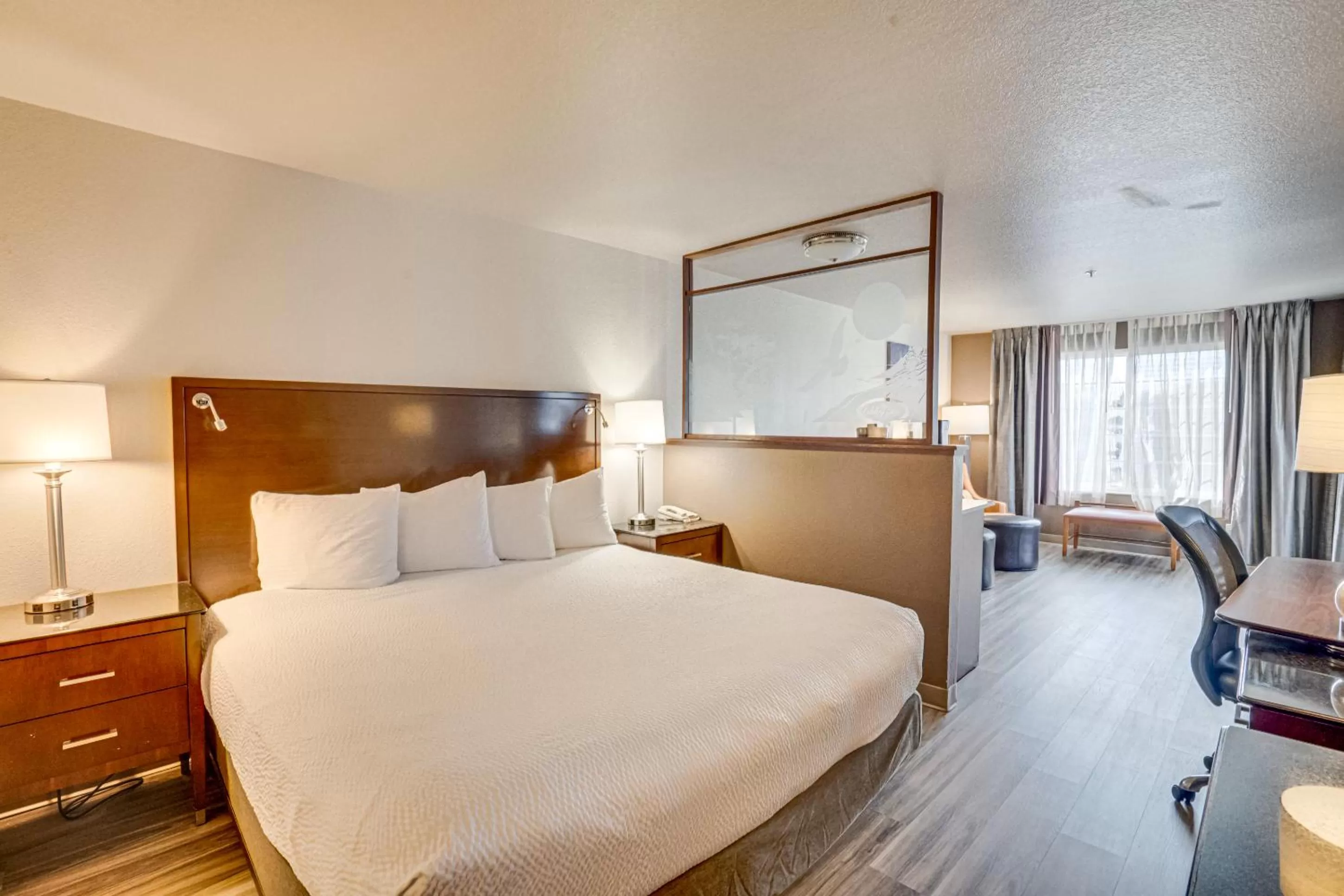 Bed in The Ashley Inn & Suites