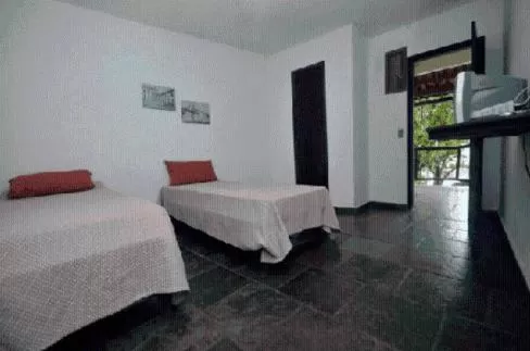 Bed in Pousada A Marca do Faraó