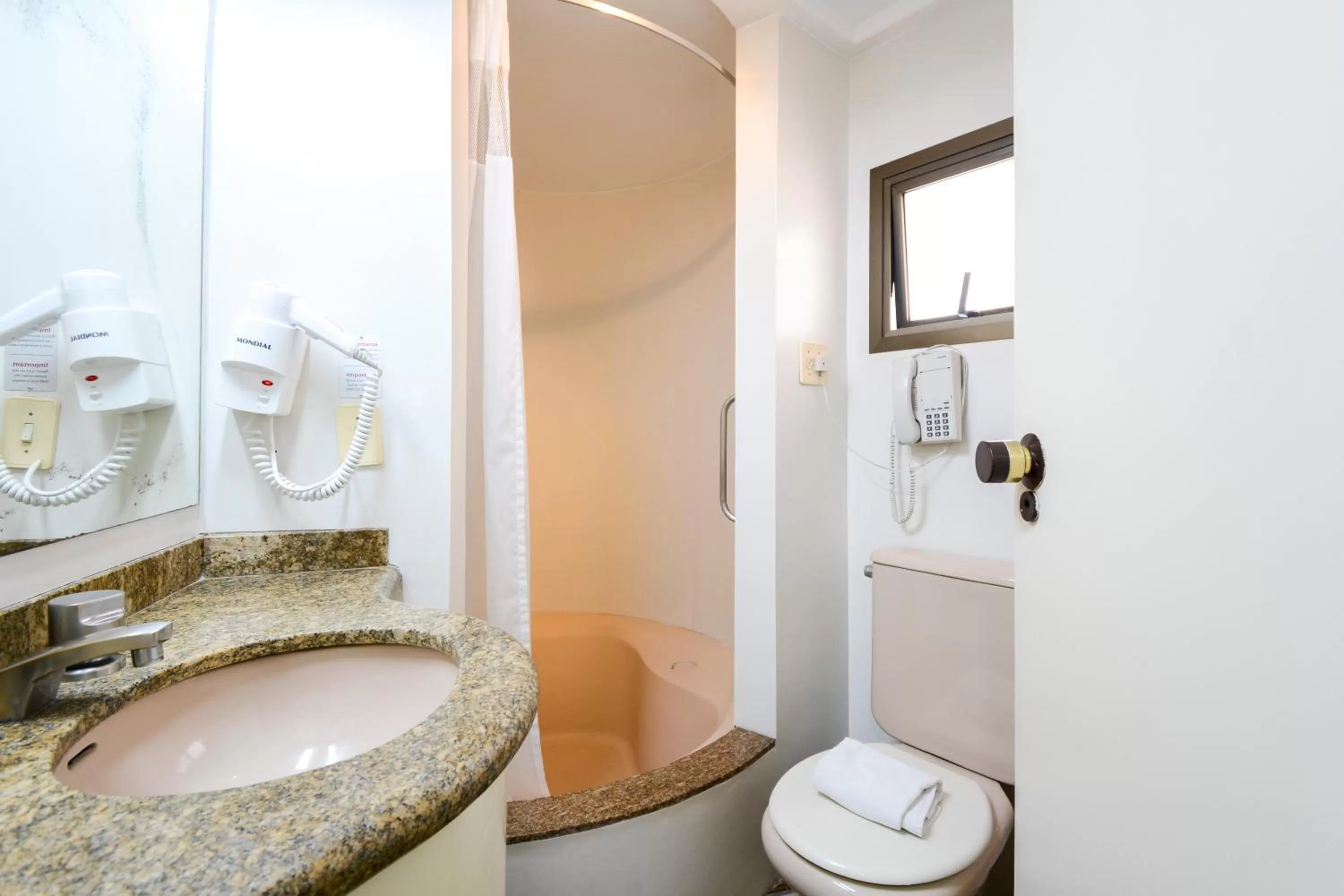 Bathroom in Wall Street Apartments by BnbHost
