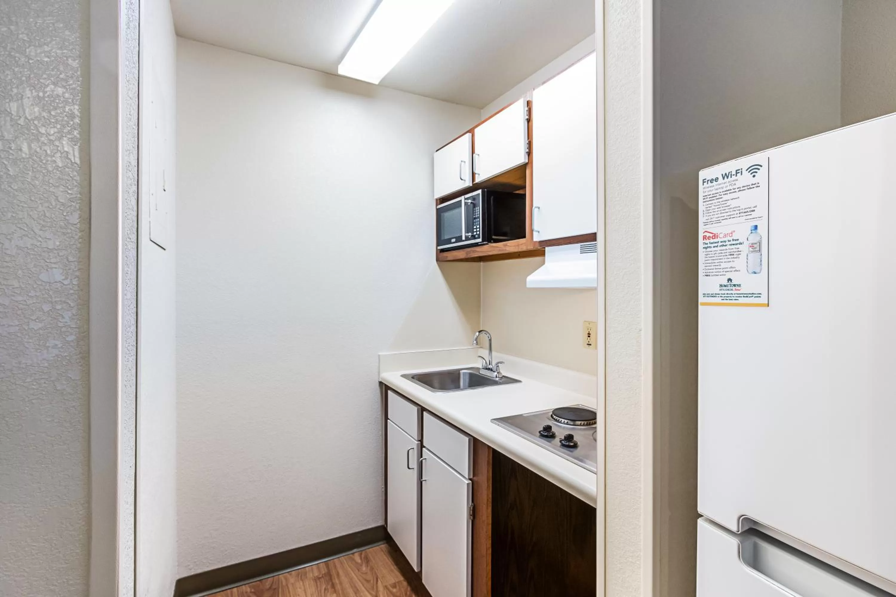 Photo of the whole room in HomeTowne Studios by Red Roof Atlanta – Lawrenceville