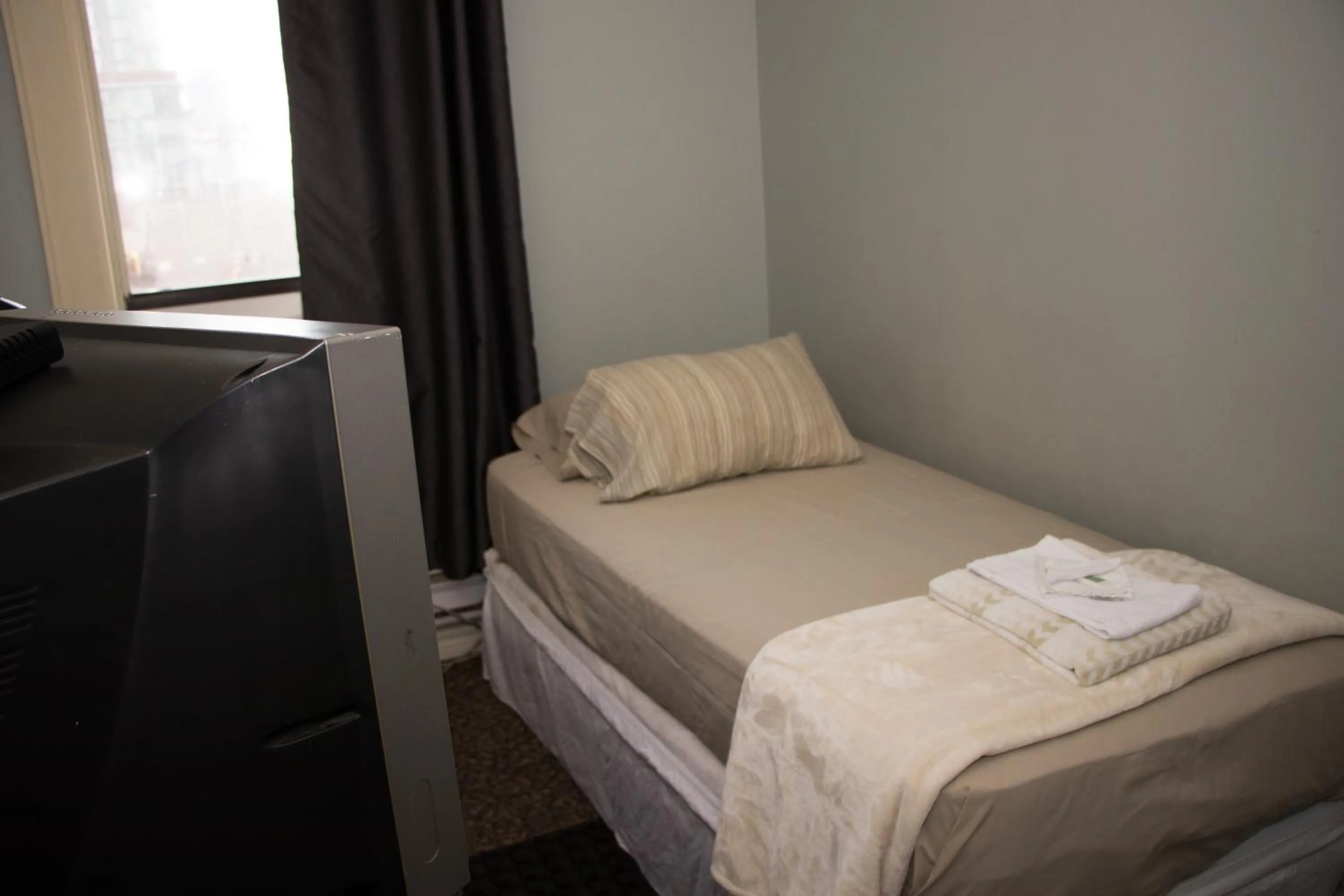 Bed in Saint Lawrence Residences and Suites