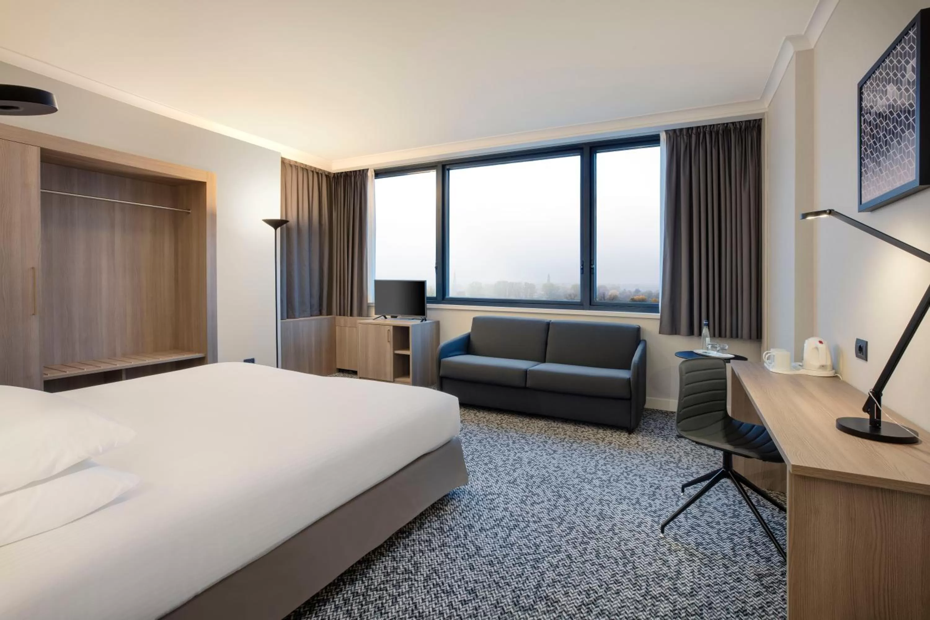 Photo of the whole room, Bed in Crowne Plaza Milan Linate by IHG