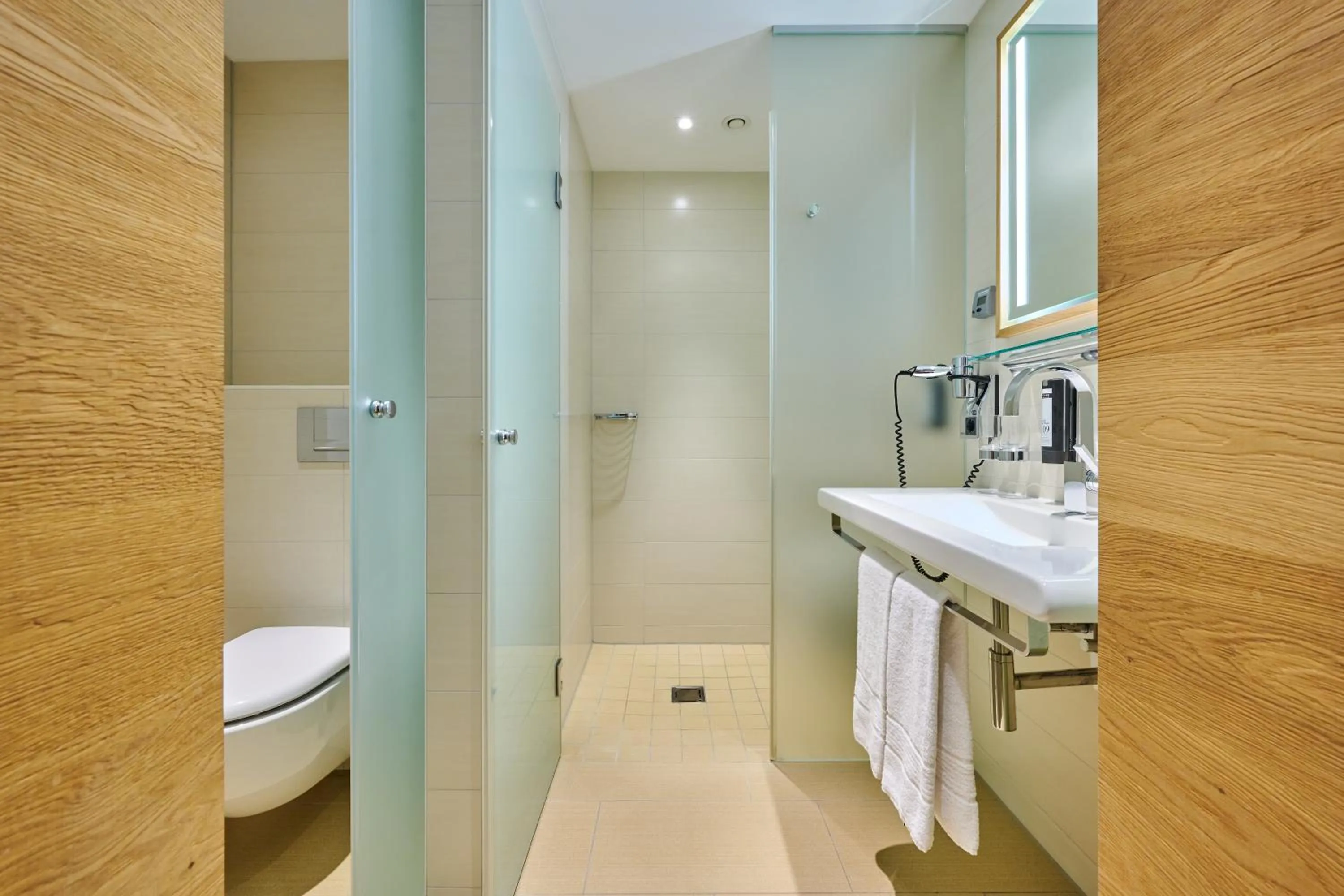 Bathroom in Asam Hotel