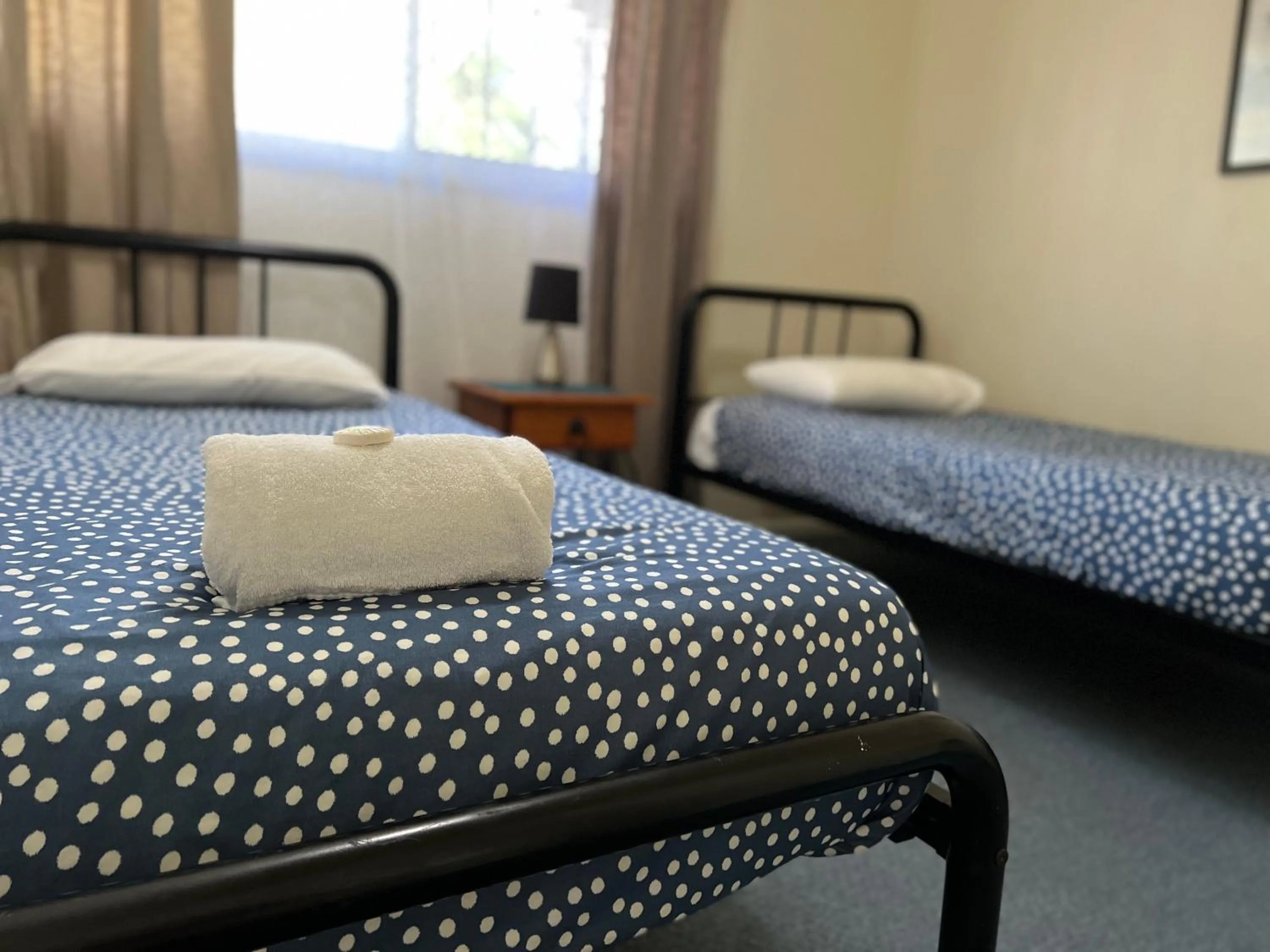 Bed in Colonial Village Resort