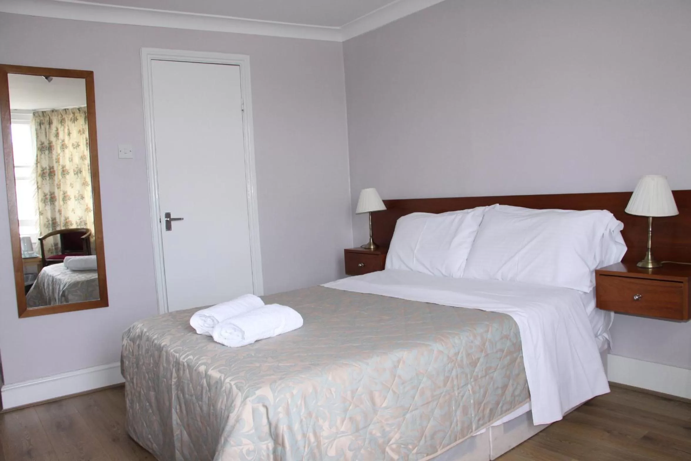 Bed in Ambassador Hotel